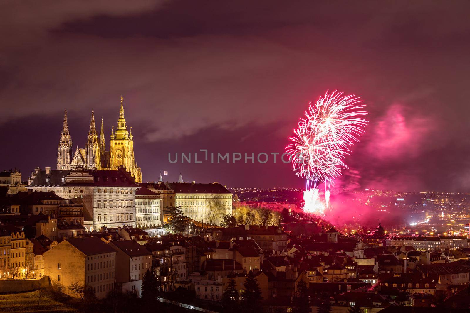 Fireworks over the Old Town of Prague, Czech Republic. New Year fireworks in Prague, Czechia. Prague fireworks during New Year Celebration near St. Vitus Cathedral, Prague, Czech republic.