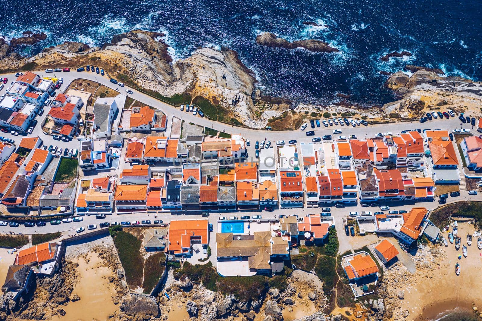 Aerial view of island Baleal naer Peniche on the shore of the ocean in west coast of Portugal. Baleal Portugal with incredible beach and surfers. Aerial view of Baleal, Portugal.