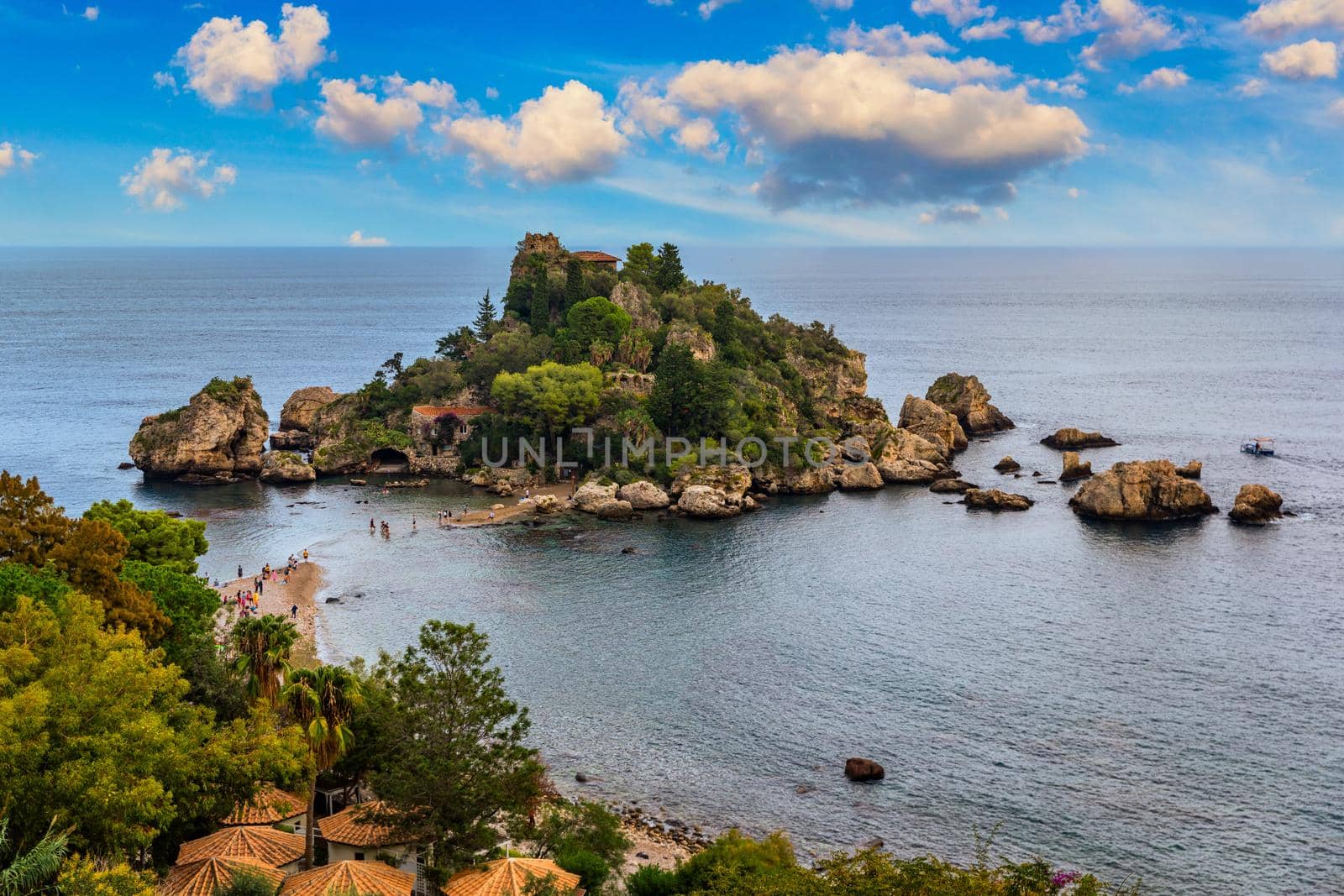 Aerial view of Isola Bella in Taormina, Sicily, Italy. Isola Bella is small island near Taormina, Sicily, Italy. Narrow path connects island to mainland Taormina beach in azure waters of Ionian Sea. 