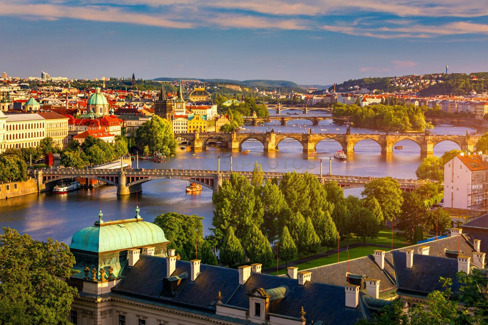 Scenic view of the Old Town pier architecture and Charles Bridge over Vltava river in Prague, Czech Republic. Prague iconic Charles Bridge (Karluv Most) and Old Town Bridge Tower at sunset, Czechia.