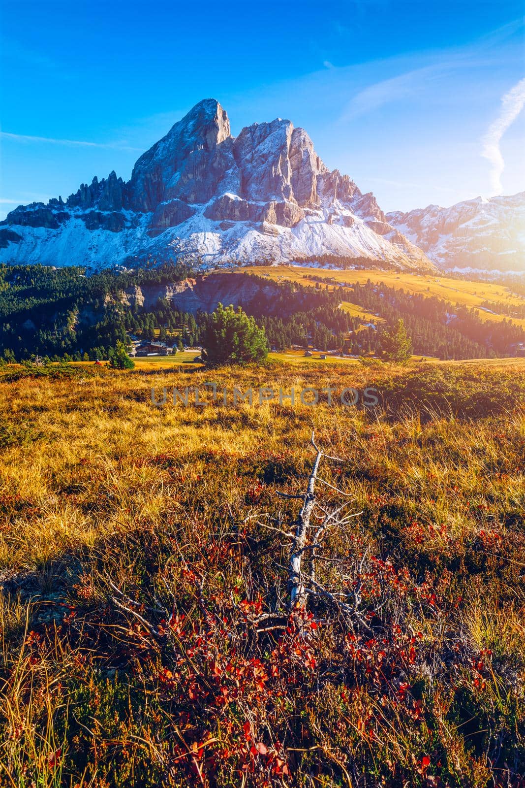 Stunning view of Peitlerkofel mountain from Passo delle Erbe in Dolomites, Italy. View of Sass de Putia (Peitlerkofel) at Passo delle Erbe, with wooden farm houses, Dolomites, South Tyrol, Italy.