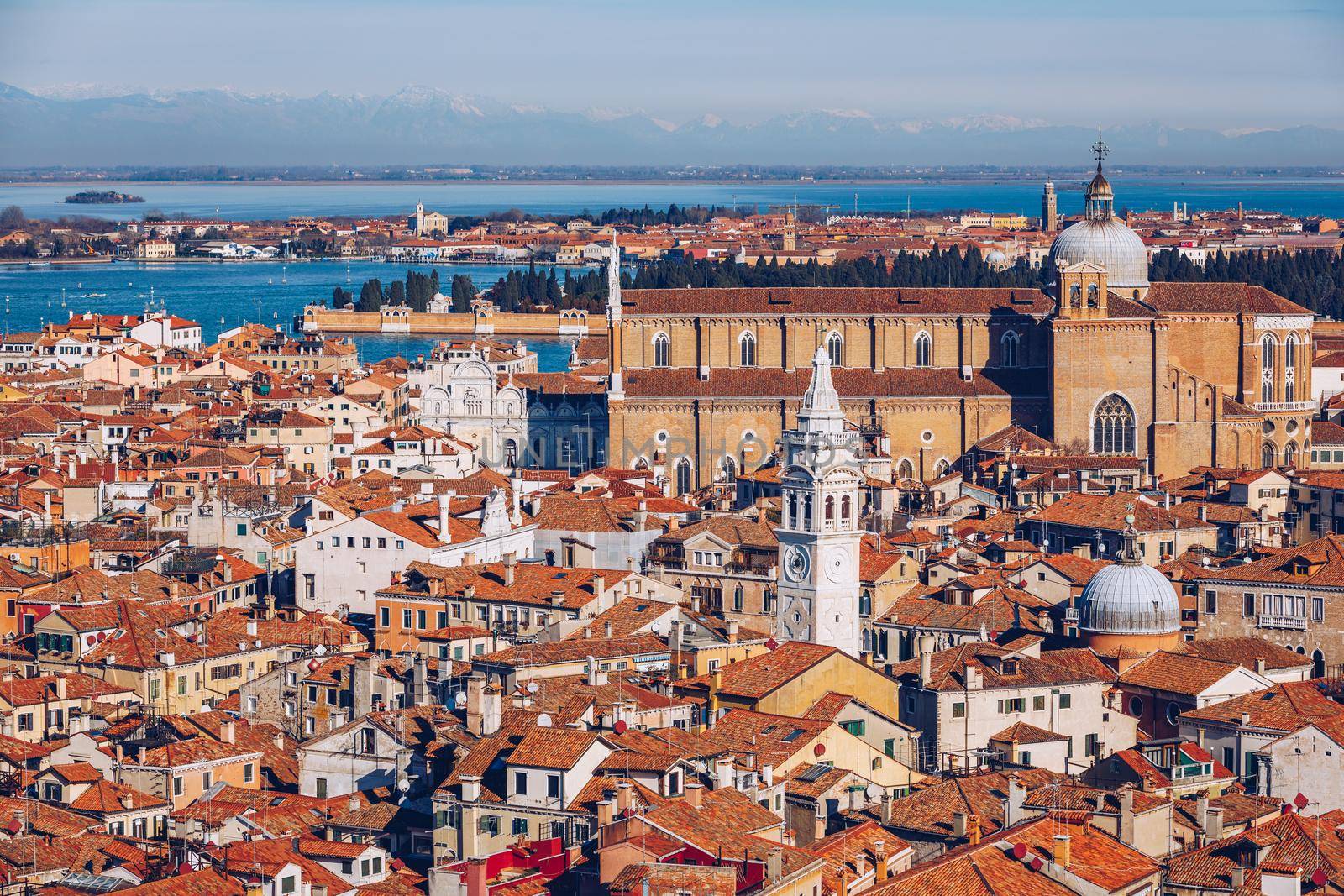Venice panoramic aerial view with red roofs, Veneto, Italy. Aerial view with dense medieval red roofs of Venice, Italy 