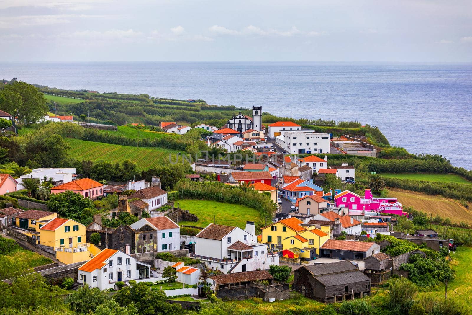 Beautiful nature view on Azores with small villages, tows, green nature fields. Amazing Azores. View of typical Azores village in Sao Miguel island, Azores, Portugal.