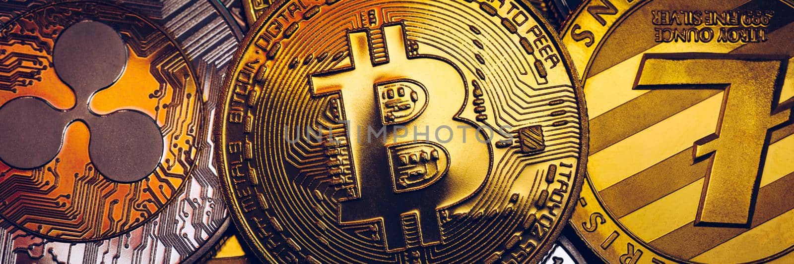 Set of cryptocurrencies with Bitcoin, Etherium, Ripple, Litecoin. Cryptocurrencys new digital money. Bitcoin on the front as the leader. Bitcoin as most important cryptocurrency.