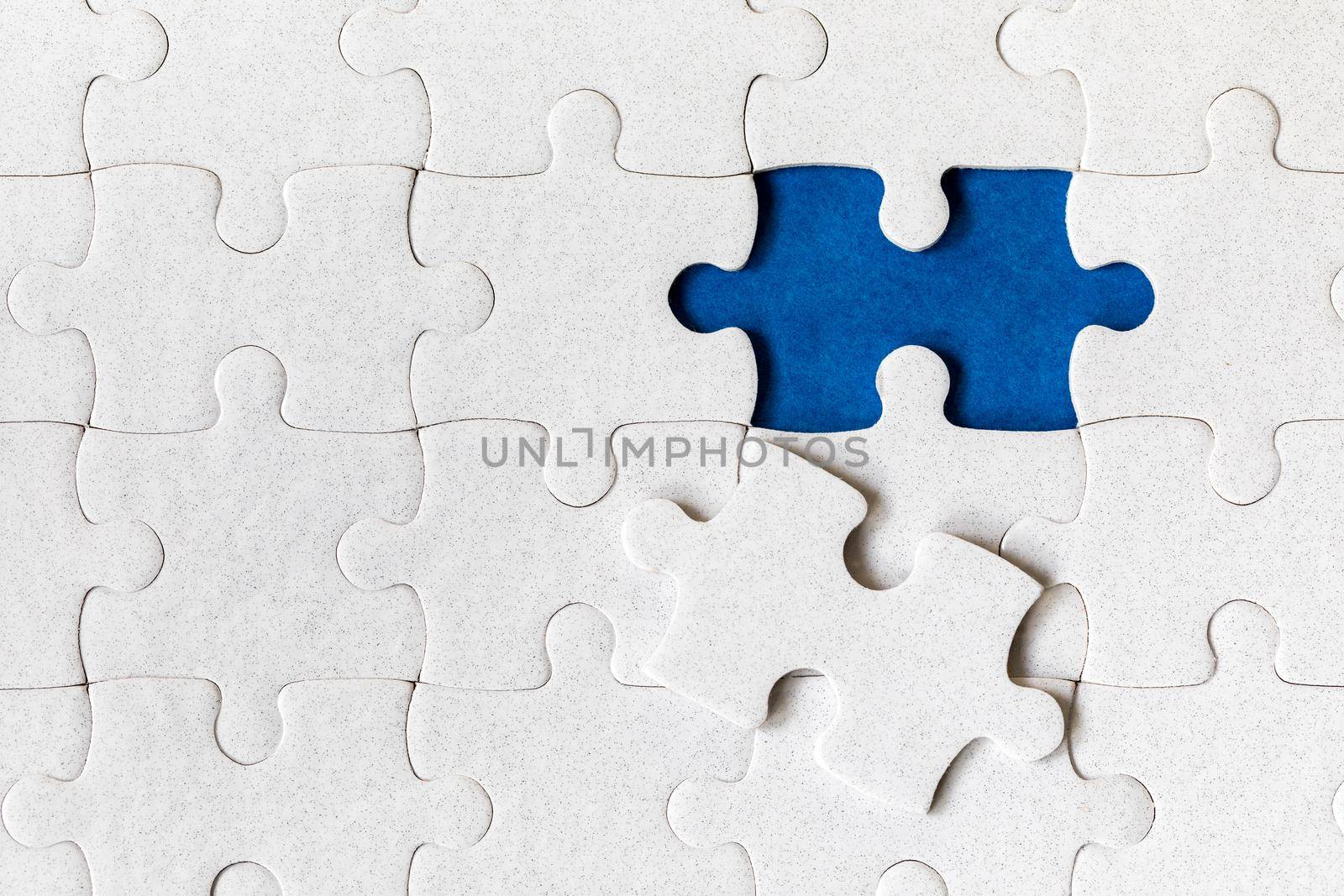 Jigsaw puzzle with missing piece. Missing puzzle pieces. Concept image of unfinished task. Completing final task, missing jigsaw puzzle pieces and business concept with a puzzle piece missing.