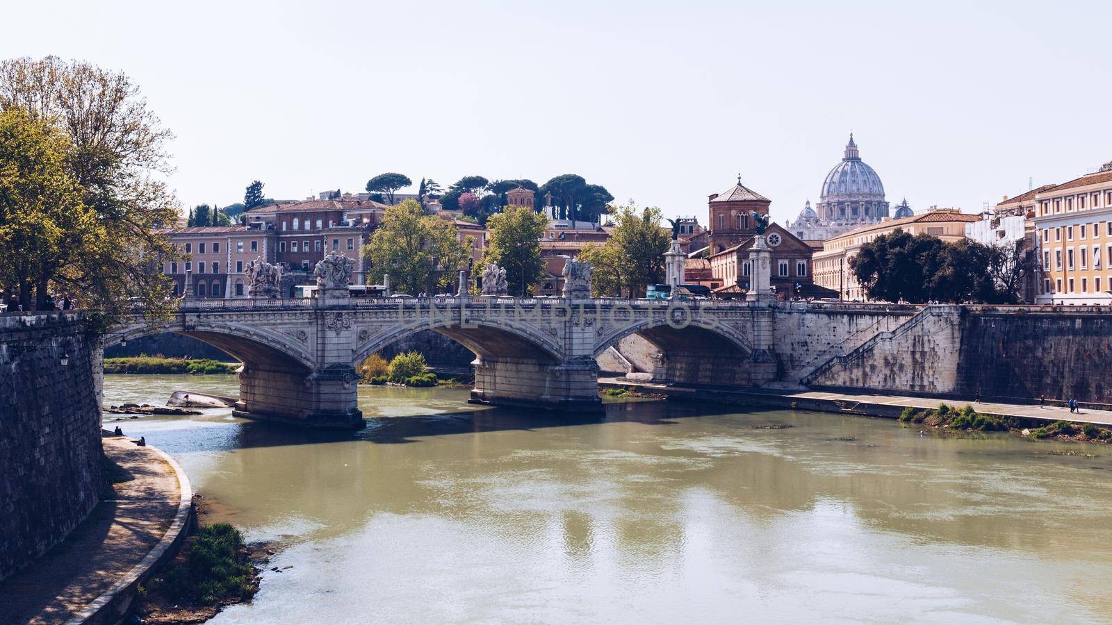 Skyline with bridge Ponte Vittorio Emanuele II and classic architecture in Rome, Vatican City scenery over Tiber river.