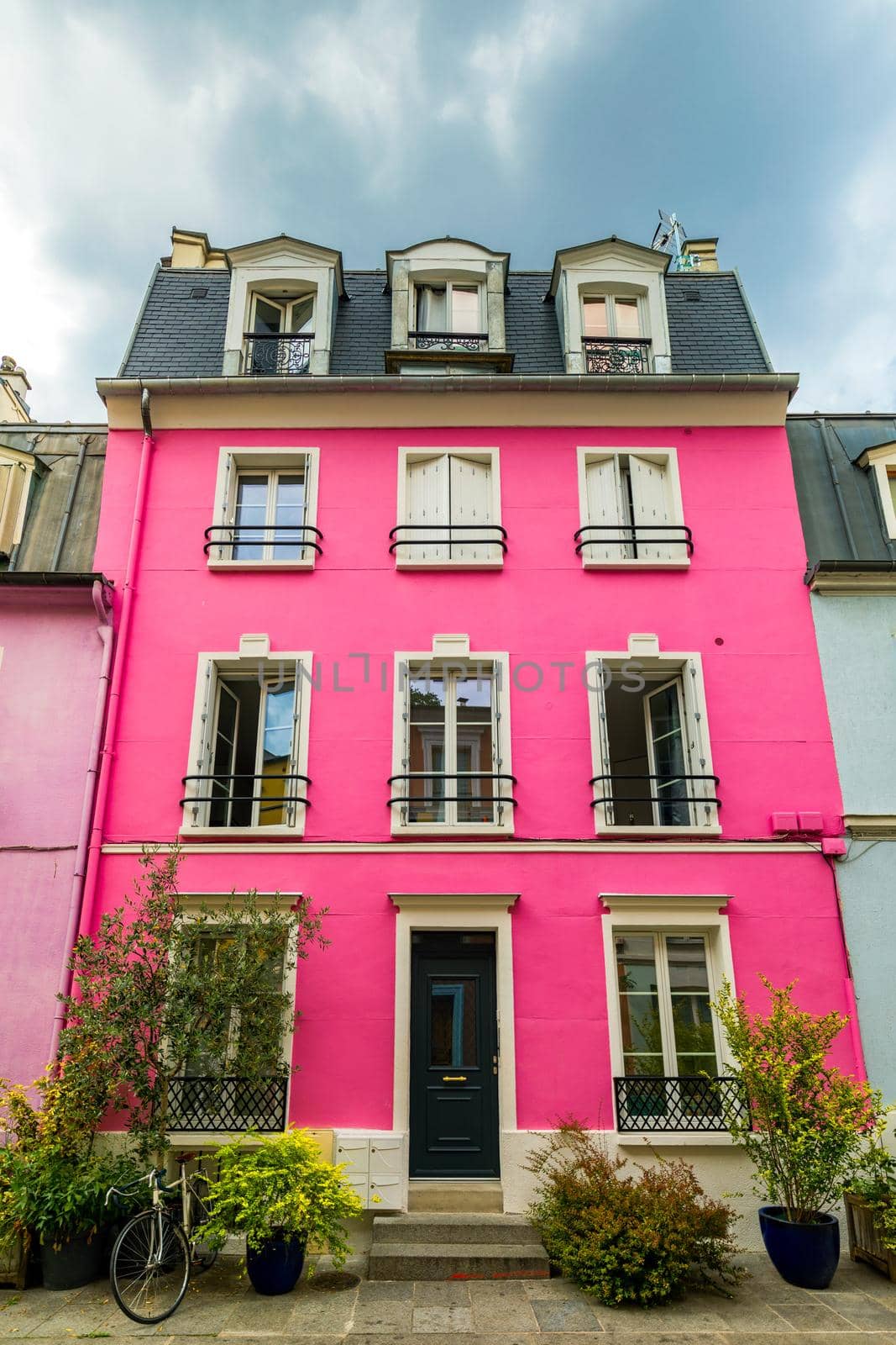 Cremieux Street (Rue Cremieux), Paris, France. Rue Cremieux in the 12th Arrondissement is one of the prettiest residential streets in Paris. Colored houses in Rue Cremieux street in Paris. France.