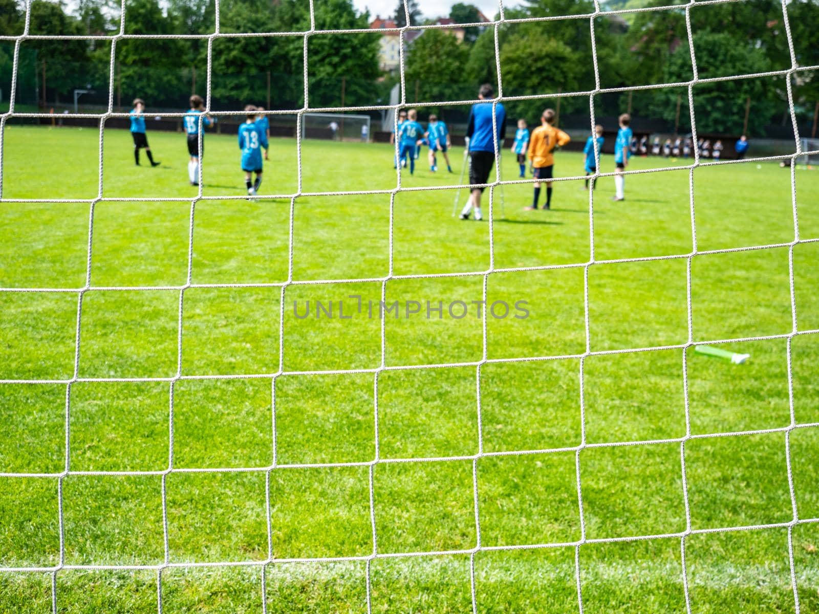 Football soccers running follow ball goal into net  by rdonar2