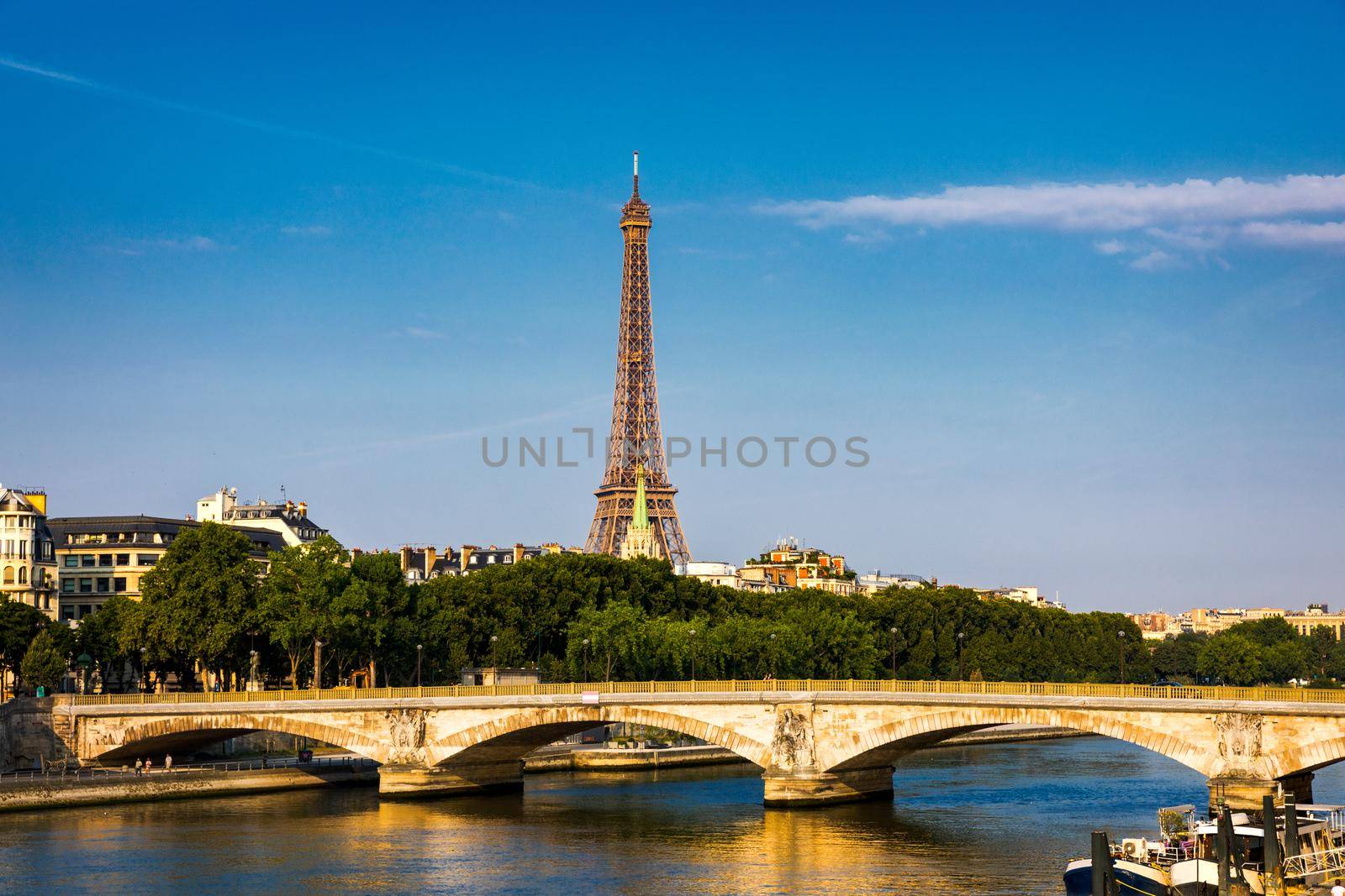 Paris Eiffel Tower and river Seine at sunset in Paris, France. Eiffel Tower is one of the most iconic landmarks of Paris. Eiffel tower in summer, Paris, France. The Eiffel Tower in Paris, France.