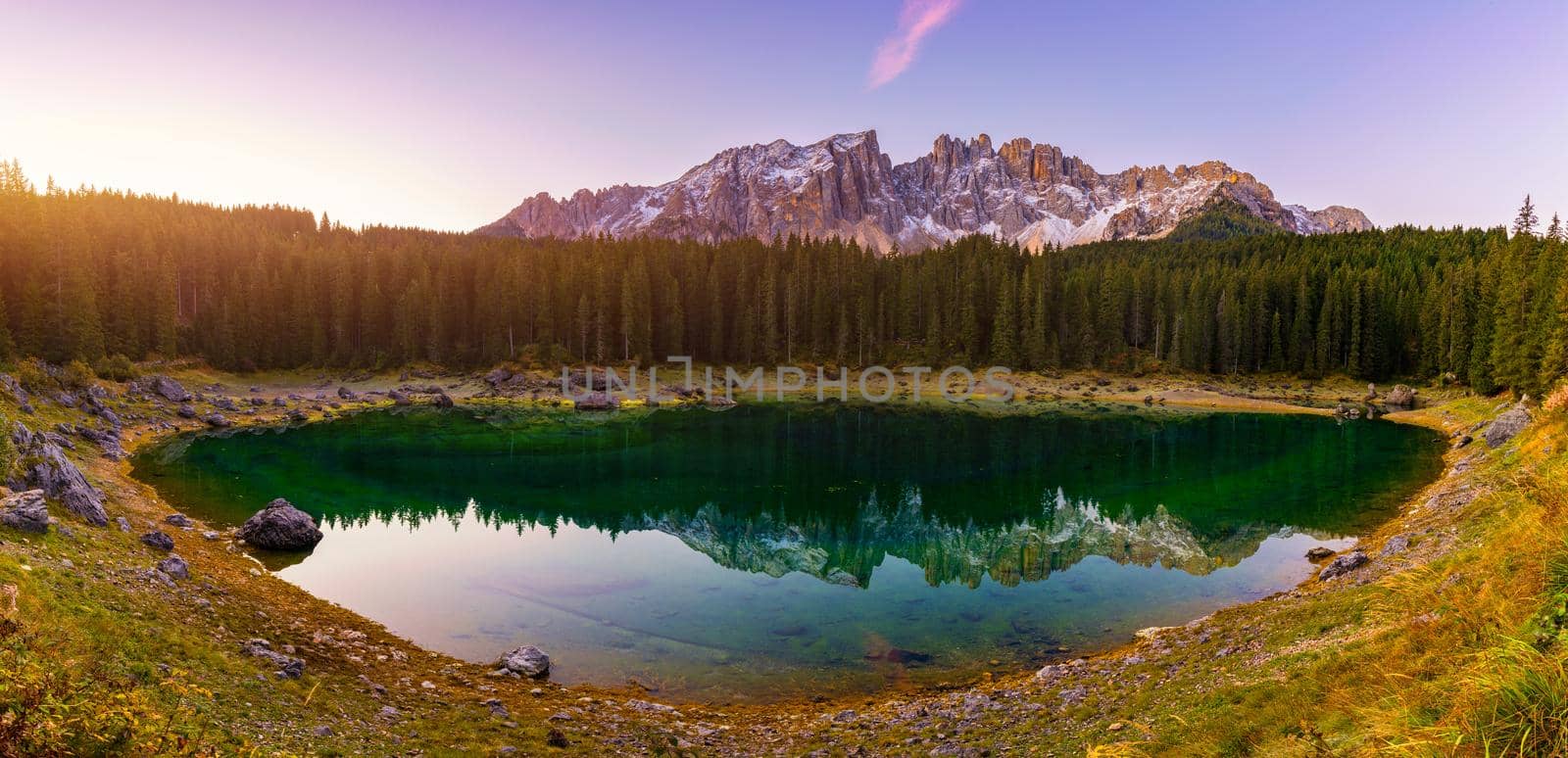 Carezza lake (Lago di Carezza, Karersee) with Mount Latemar, Bolzano province, South tyrol, Italy. Landscape of Lake Carezza or Karersee and Dolomites in background, Nova Levante, Bolzano, Italy.