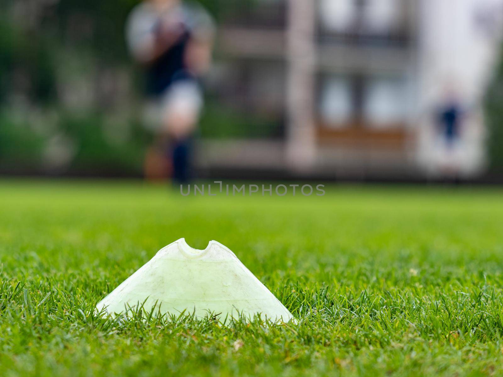 Football turf detail while Soccer Team Training on Soccer Stadium. Dribbling soccer ball