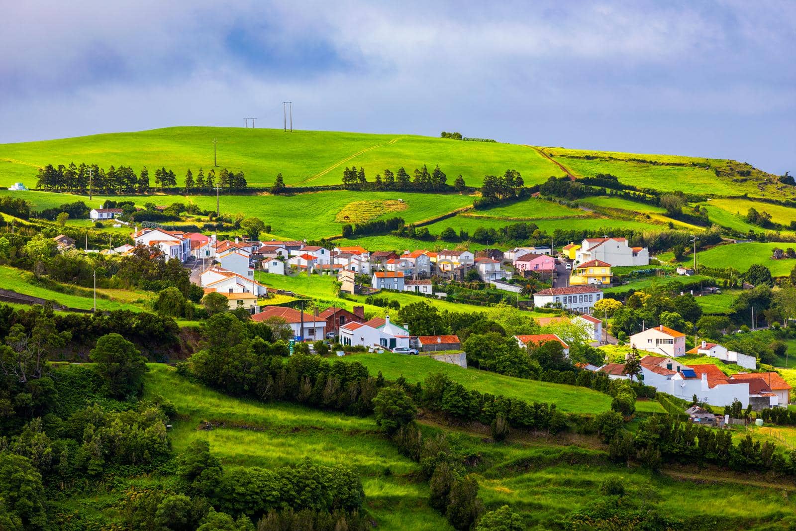 Beautiful nature view on Azores with small villages, tows, green nature fields. Amazing Azores. View of typical Azores village in Sao Miguel island, Azores, Portugal.