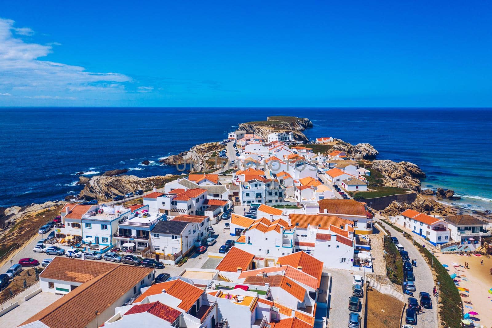 Aerial view of island Baleal naer Peniche on the shore of the ocean in west coast of Portugal. Baleal Portugal with incredible beach and surfers. Aerial view of Baleal, Portugal.