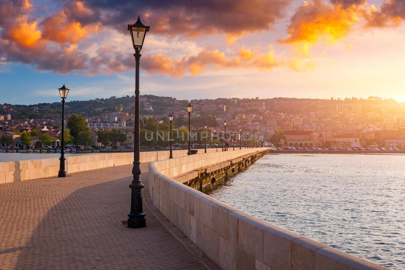 View of the De Bosset Bridge in Argostoli city on Kefalonia island. De Bosset Bridge on lakeside In Argostoli, Kefalonia. Obelisk and the de Bosset bridge in Argostoli, Kefalonia, Greece