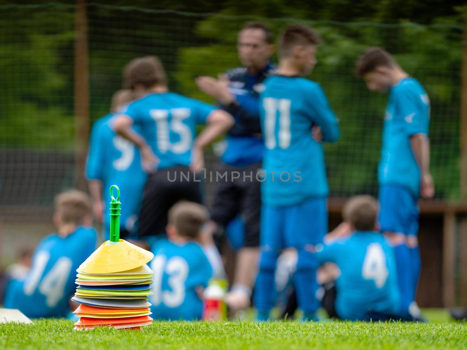 Football players have meeting with coach within football match by rdonar2