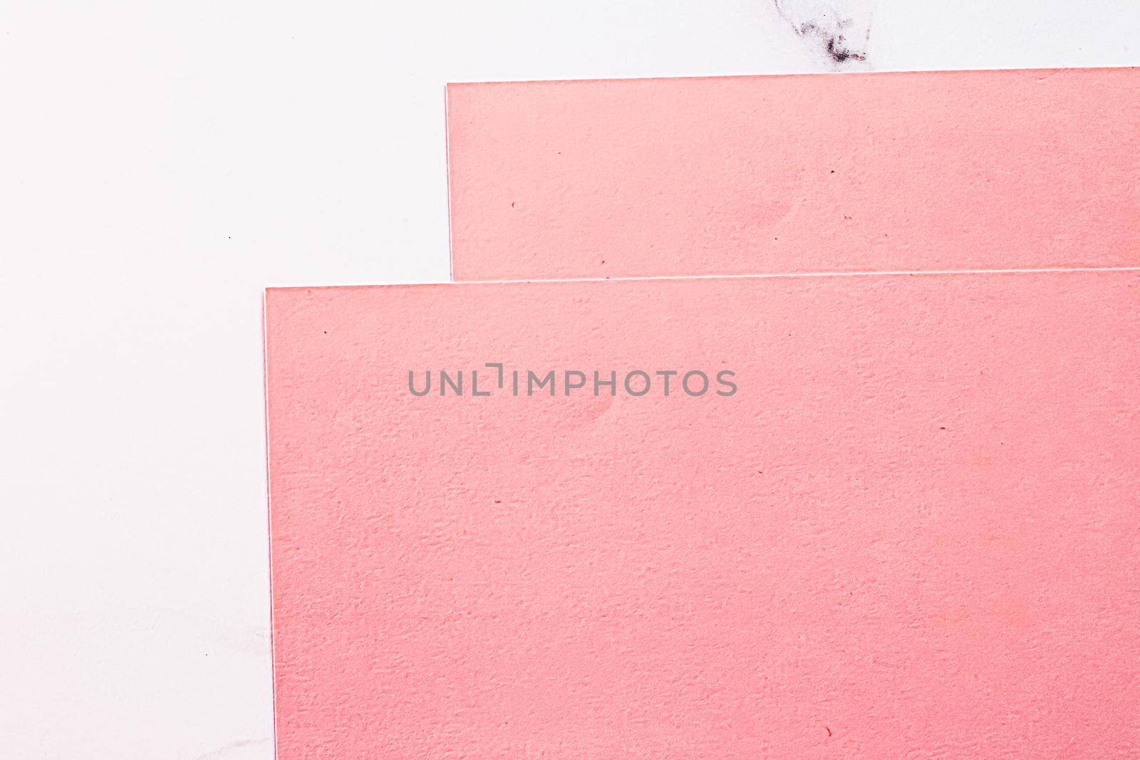 Pink A4 papers on white marble background as office stationery flatlay, luxury branding flat lay and brand identity design for mockups