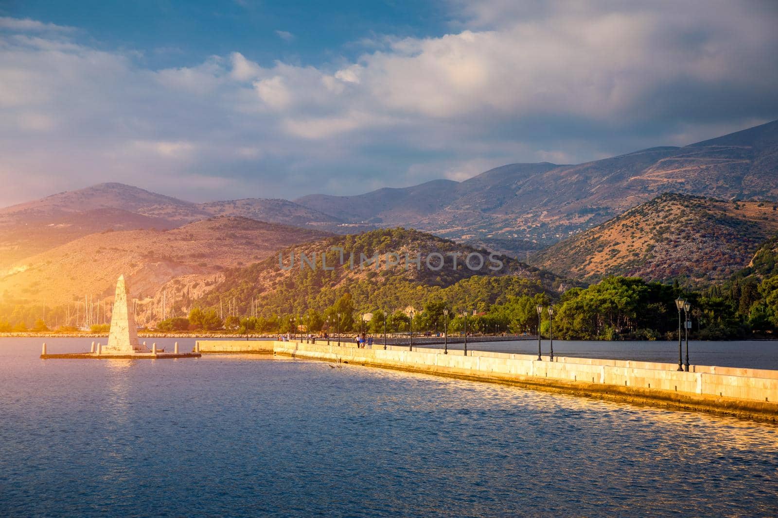View of the De Bosset Bridge in Argostoli city on Kefalonia island. De Bosset Bridge on lakeside In Argostoli, Kefalonia. Obelisk and the de Bosset bridge in Argostoli, Kefalonia, Greece