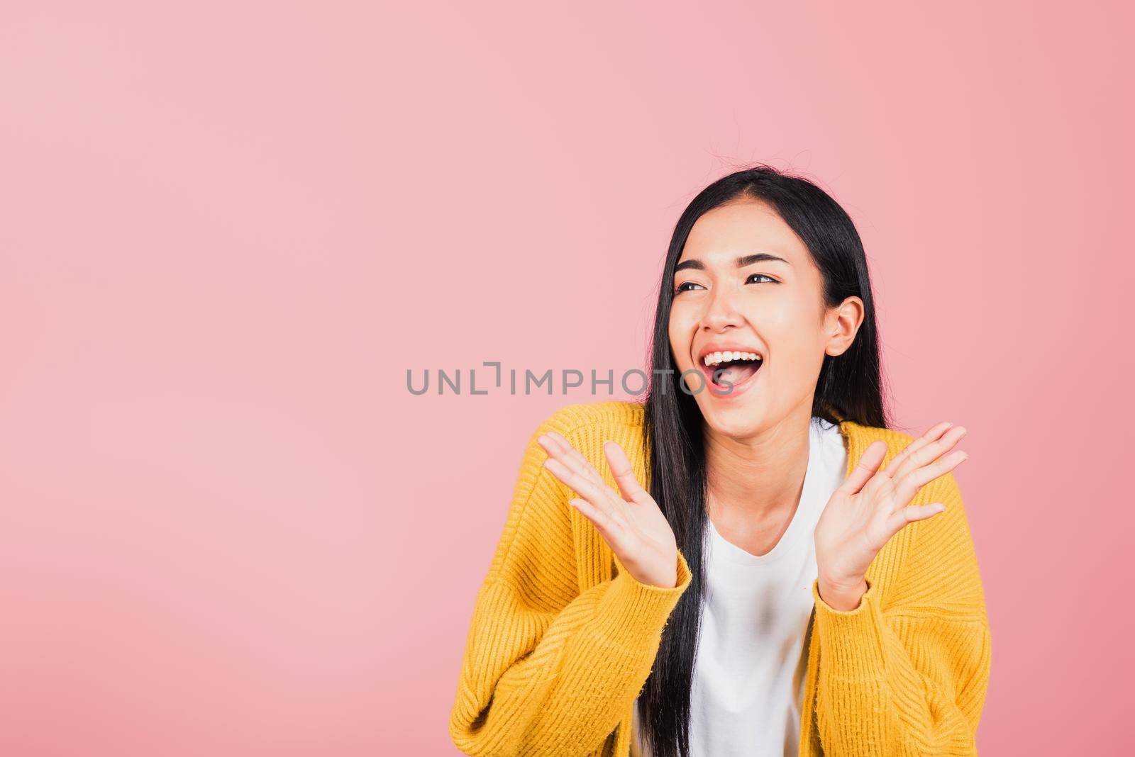 Happy Asian portrait beautiful cute young woman standing surprised excited screaming open mouth show hand studio shot isolated on pink background, Thai female smile winner successful with copy space