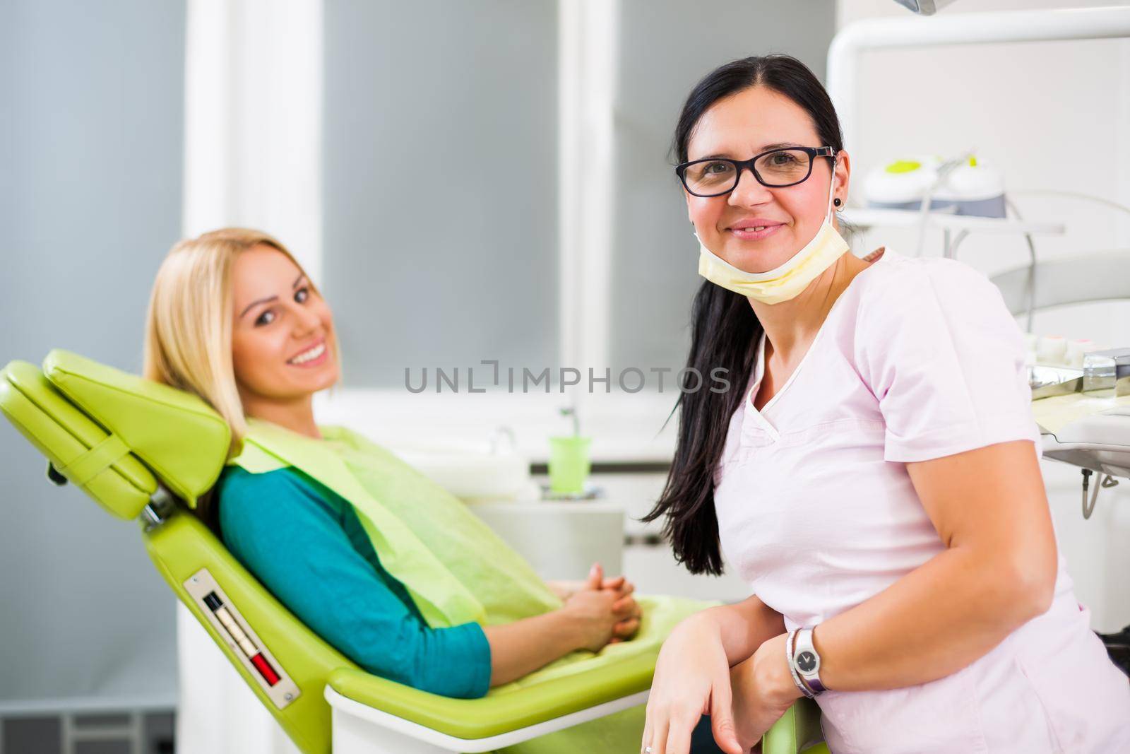 Happy young woman at dentist.