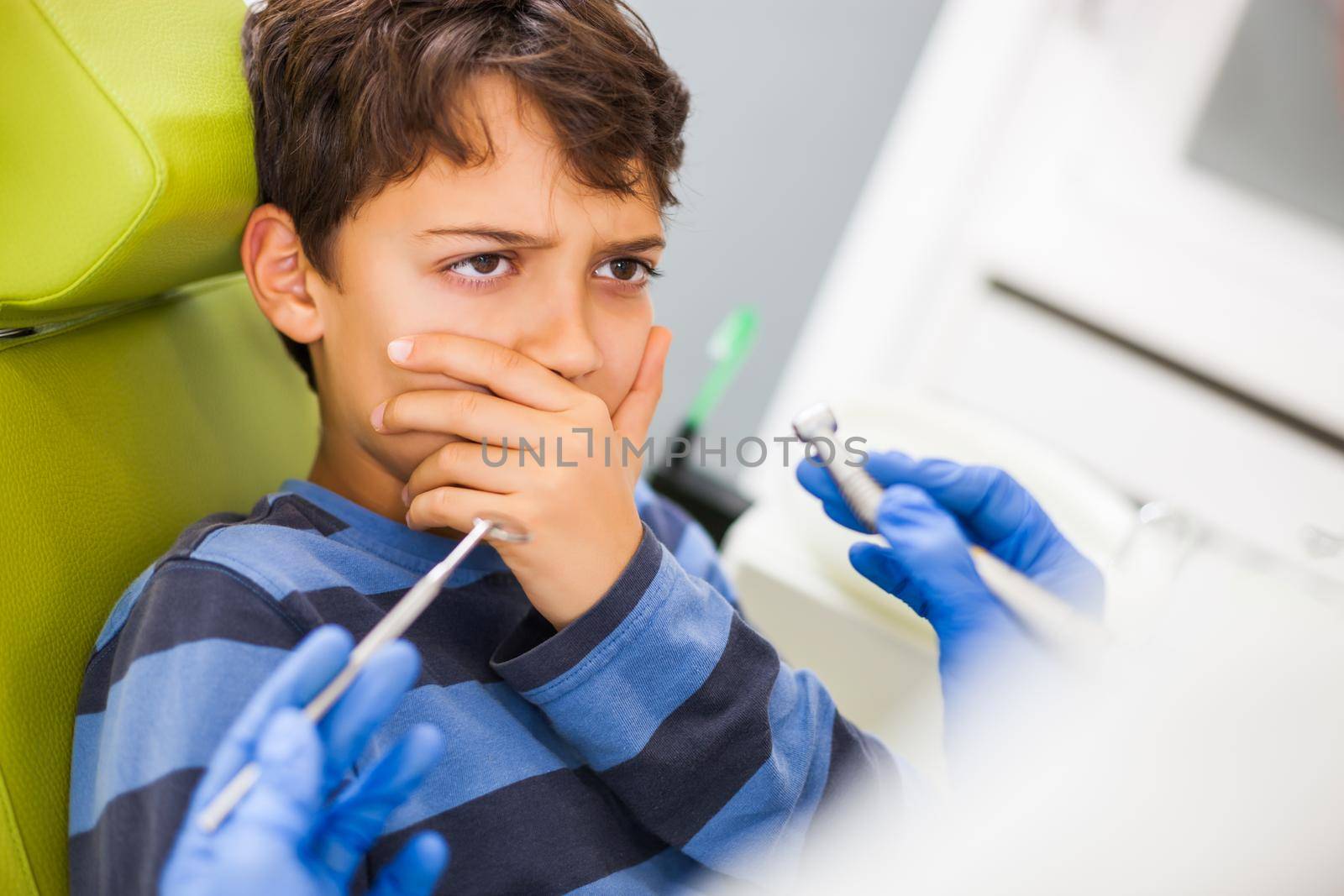 Little boy is afraid of dentist.