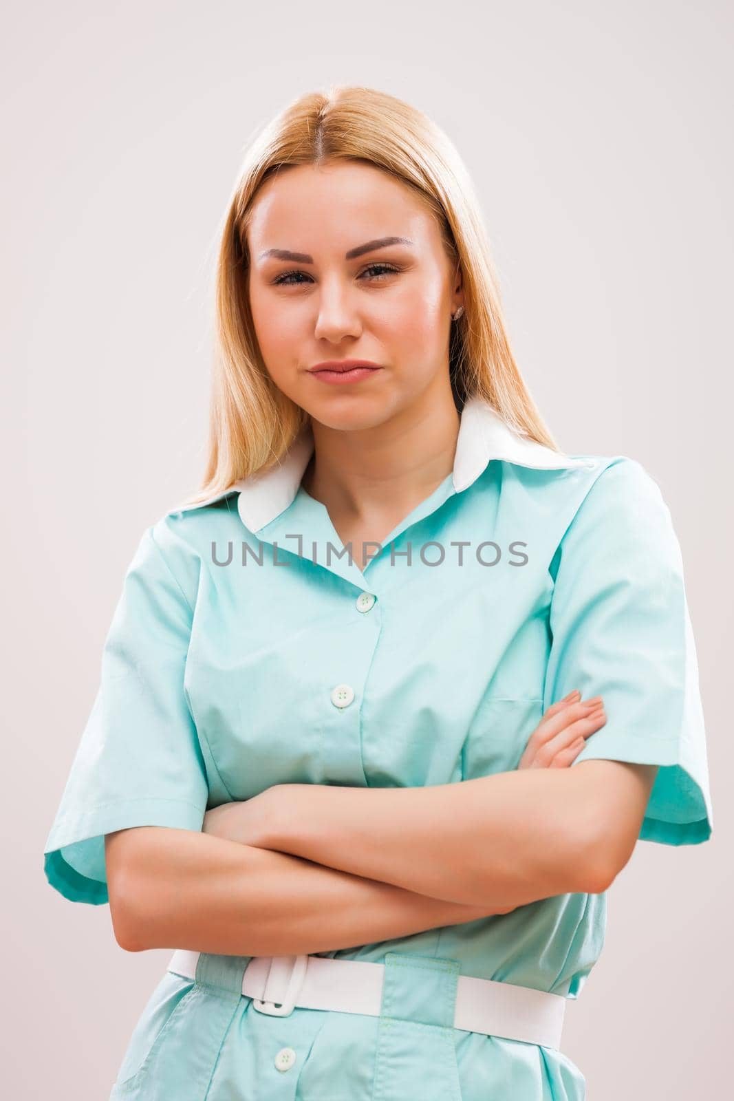 Portrait of young nurse who is worried and distraught.
