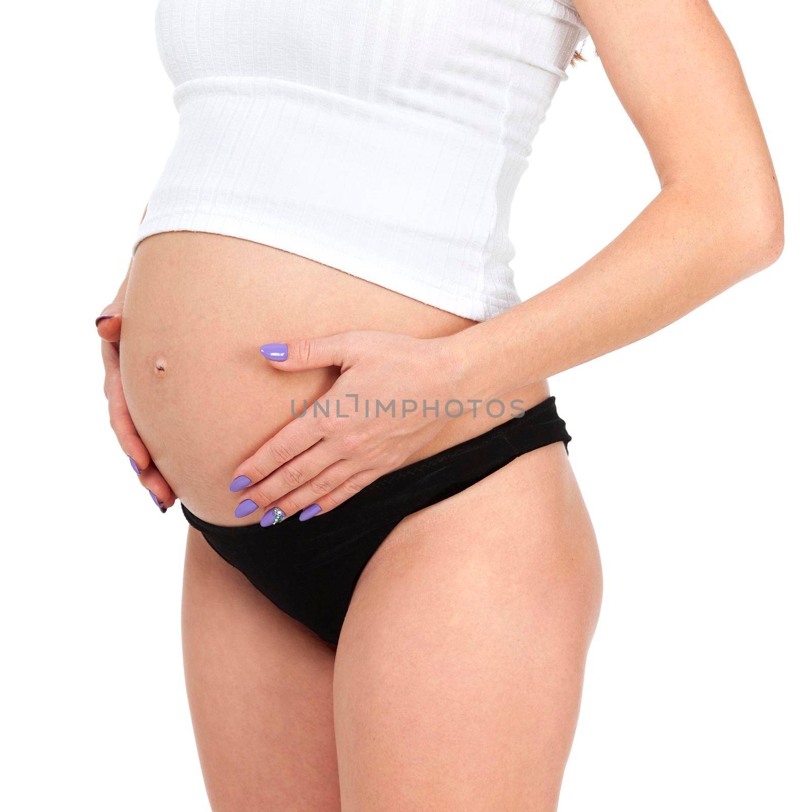 Pregnant woman posing against white background, isolated