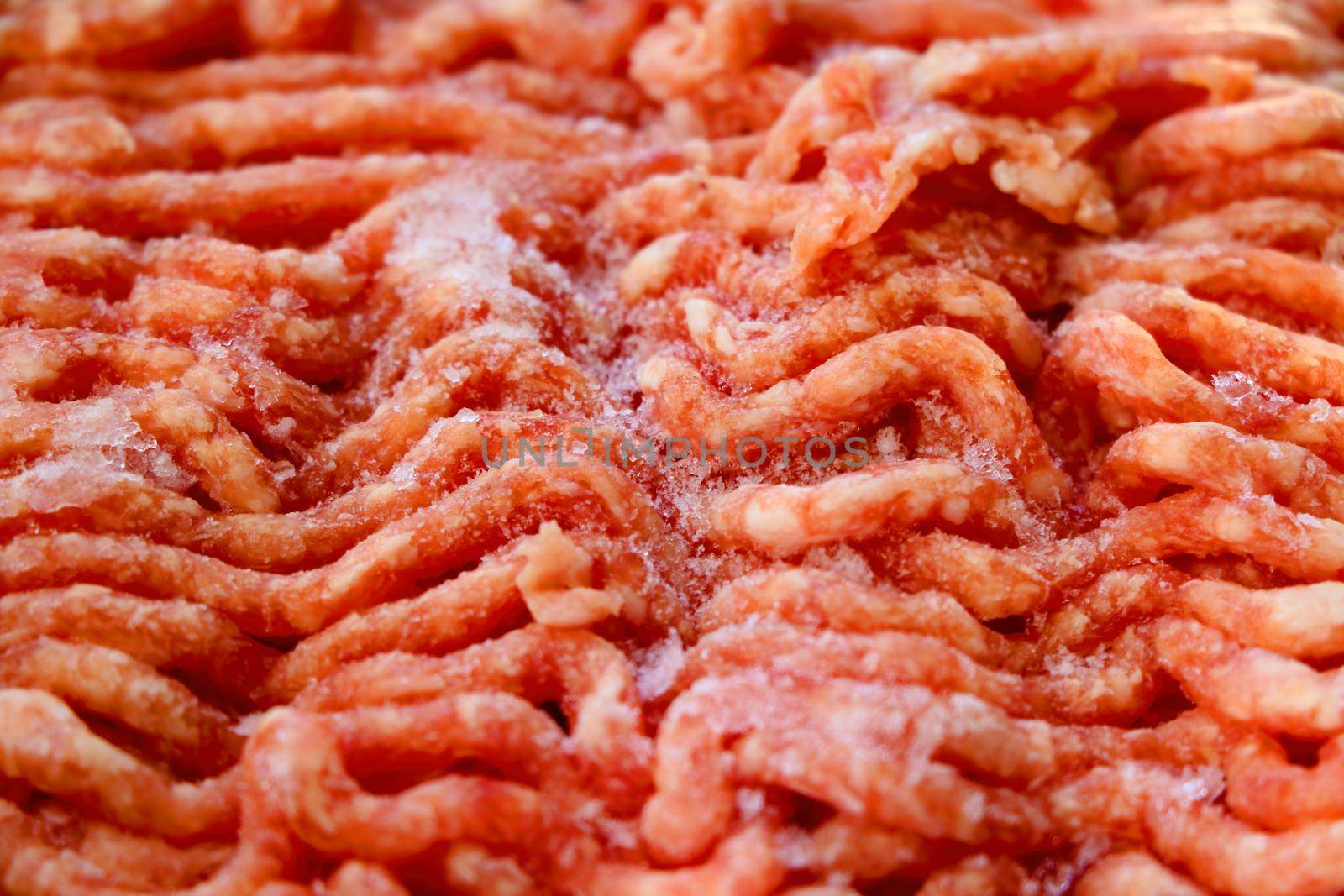 The texture of red frozen minced meat