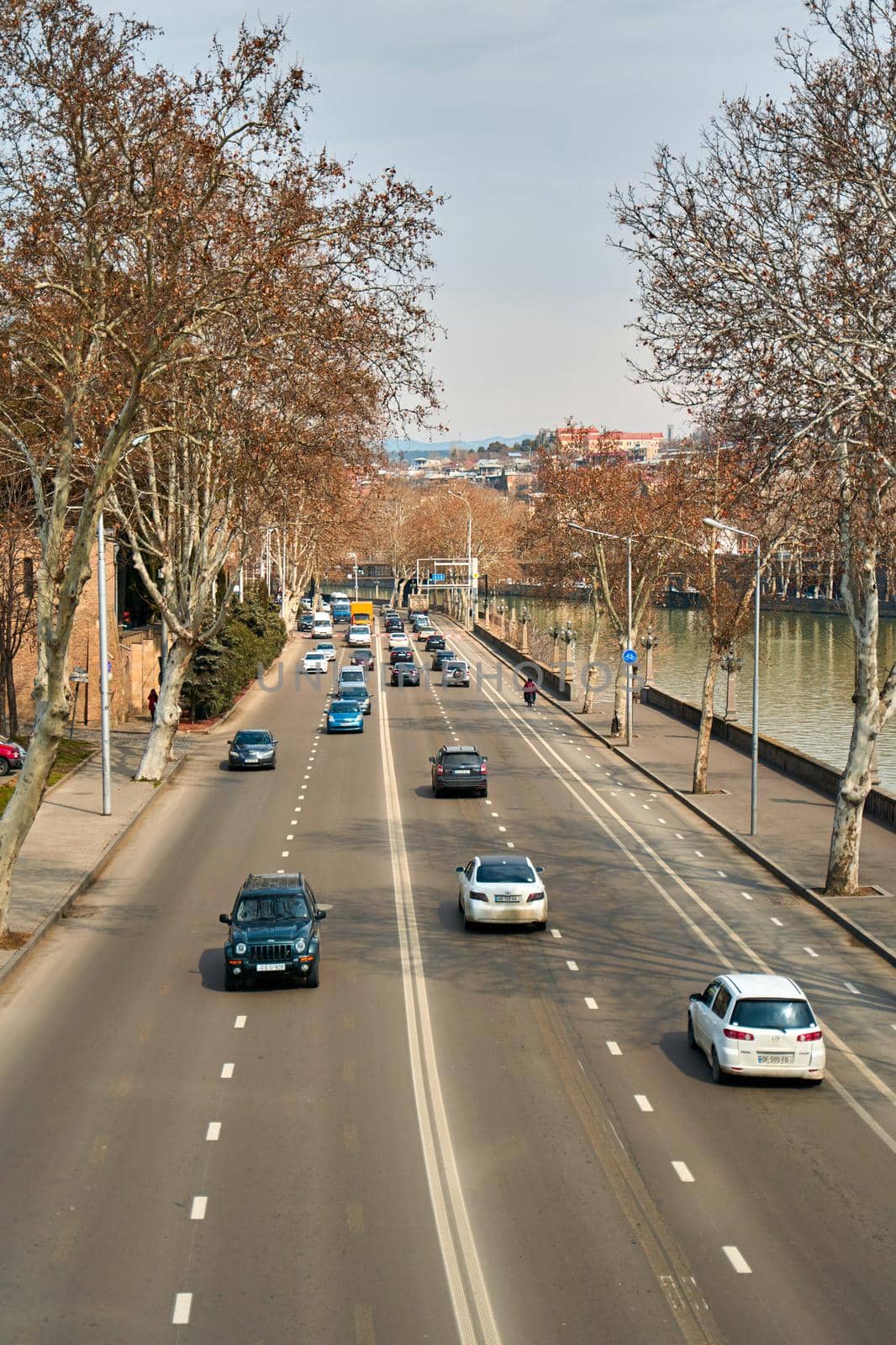 Car road on the bank of the river.