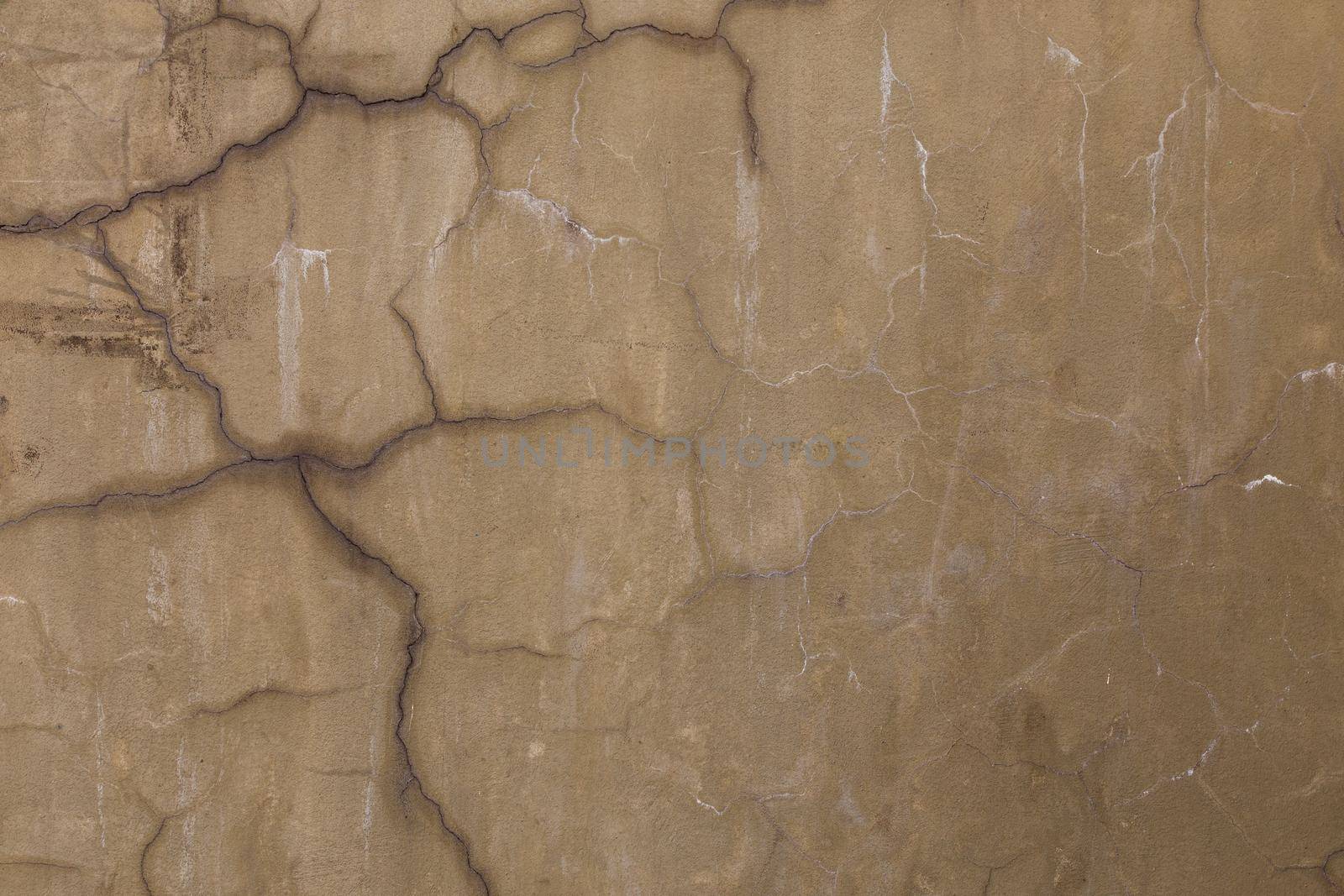 gray dirty cracked plaster wall - flat texture and full frame background.