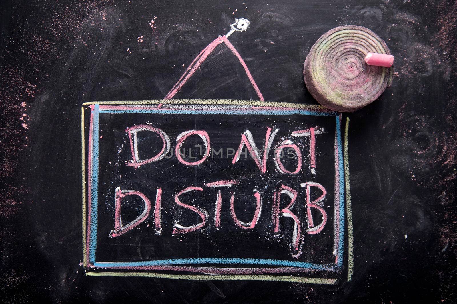 Graphic representation of the word, do not disturb, written with chalk on blackboard