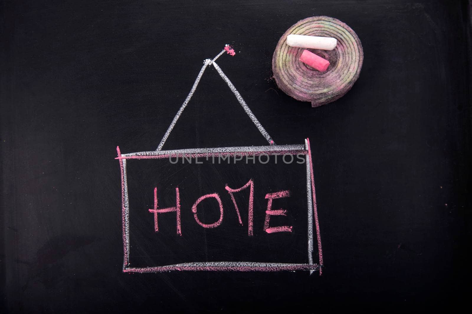 Submission of written home, with chalk on blackboard