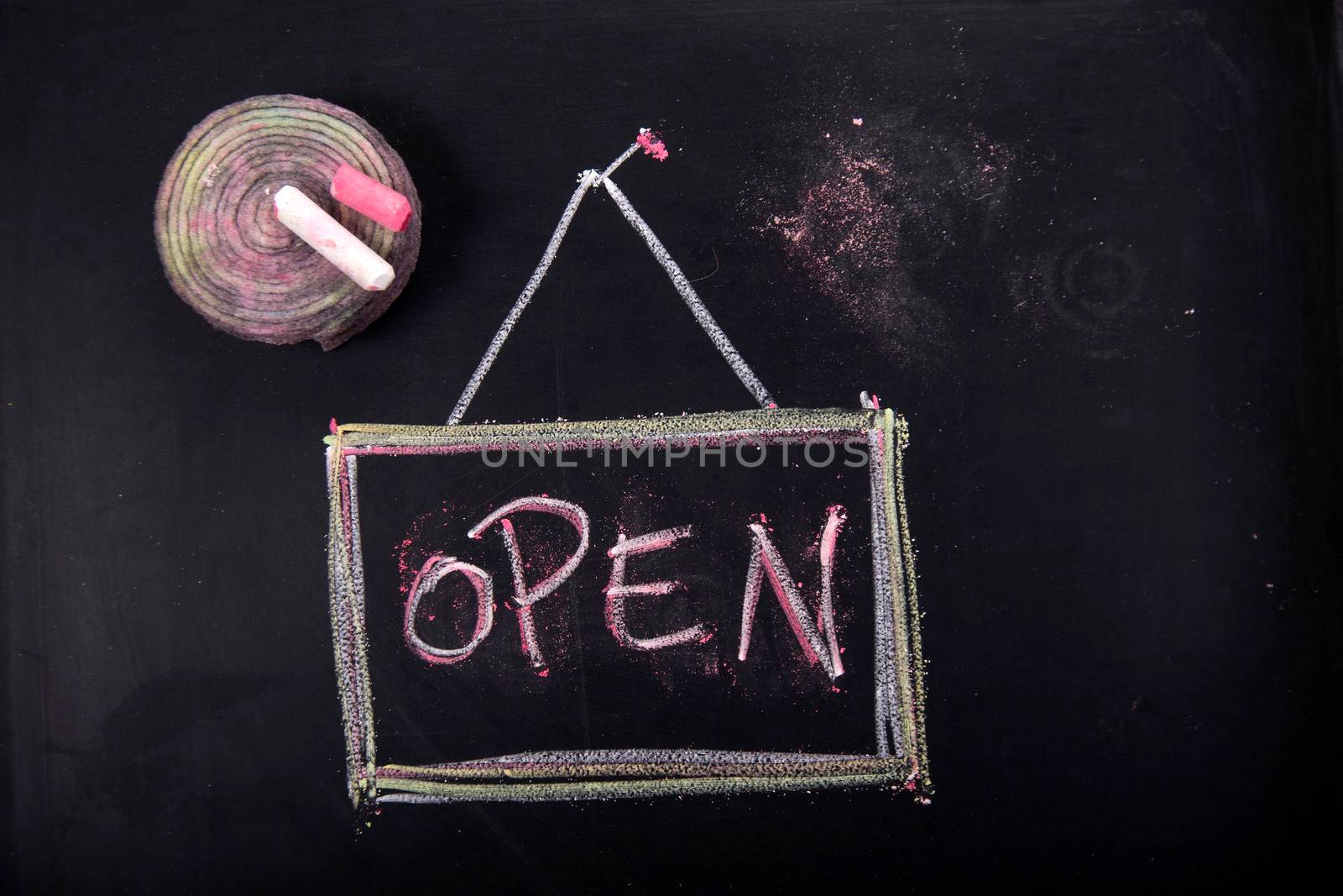 Graphic representation of the word, open, with chalk on blackboard