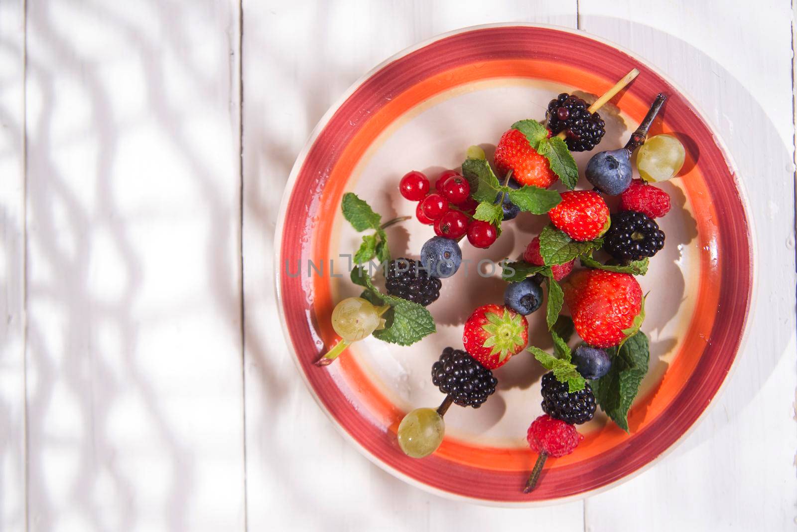 Presentation set of skewers of berries, summer dish