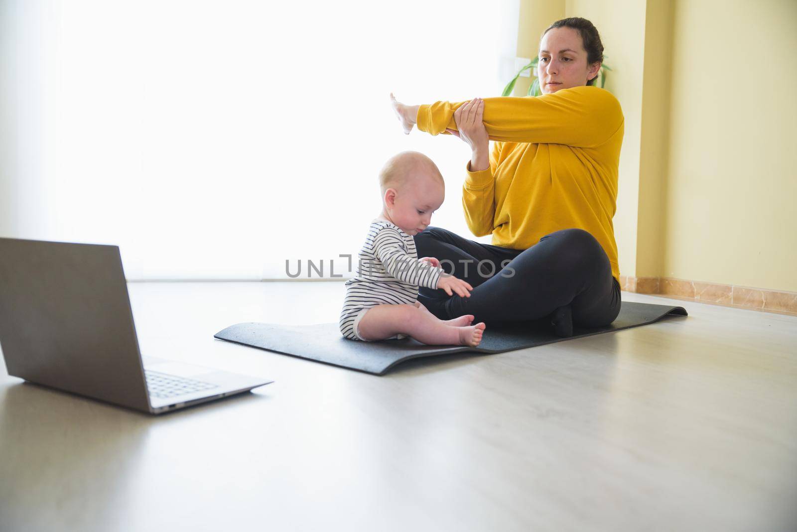 Mother and daughter doing exercise home.