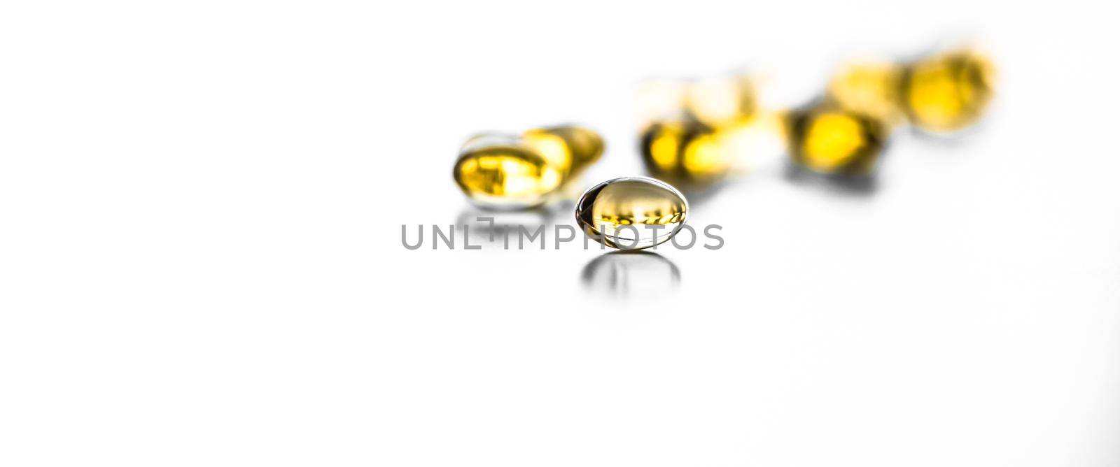 Pharmaceutical, branding and science concept - Vitamin D and golden Omega 3 pills for healthy diet nutrition, fish oil food supplement pill capsules, healthcare and medicine as pharmacy background