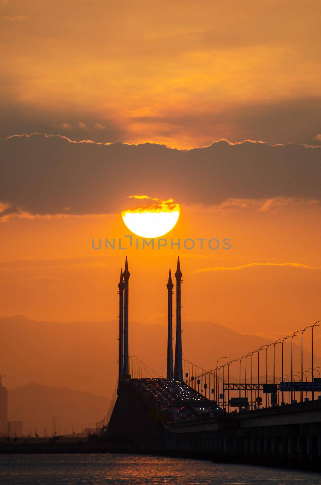 Golden sun over Penang Bridge.