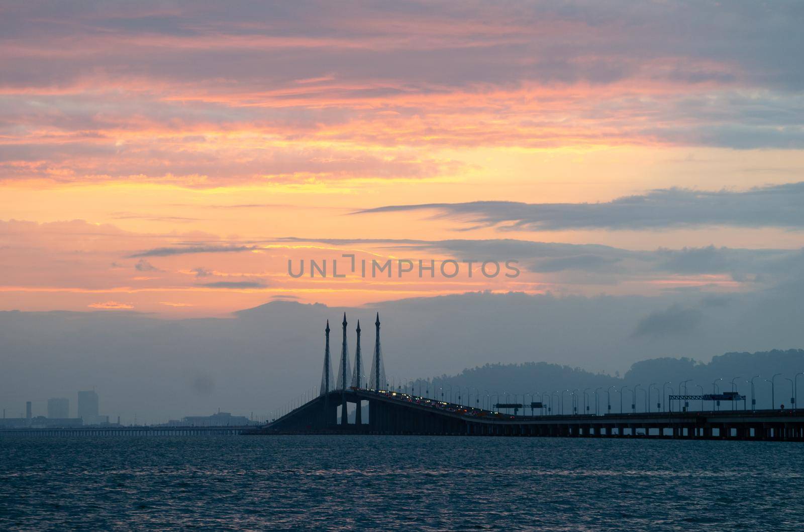 Burning sky over Penang Bridge in morning.