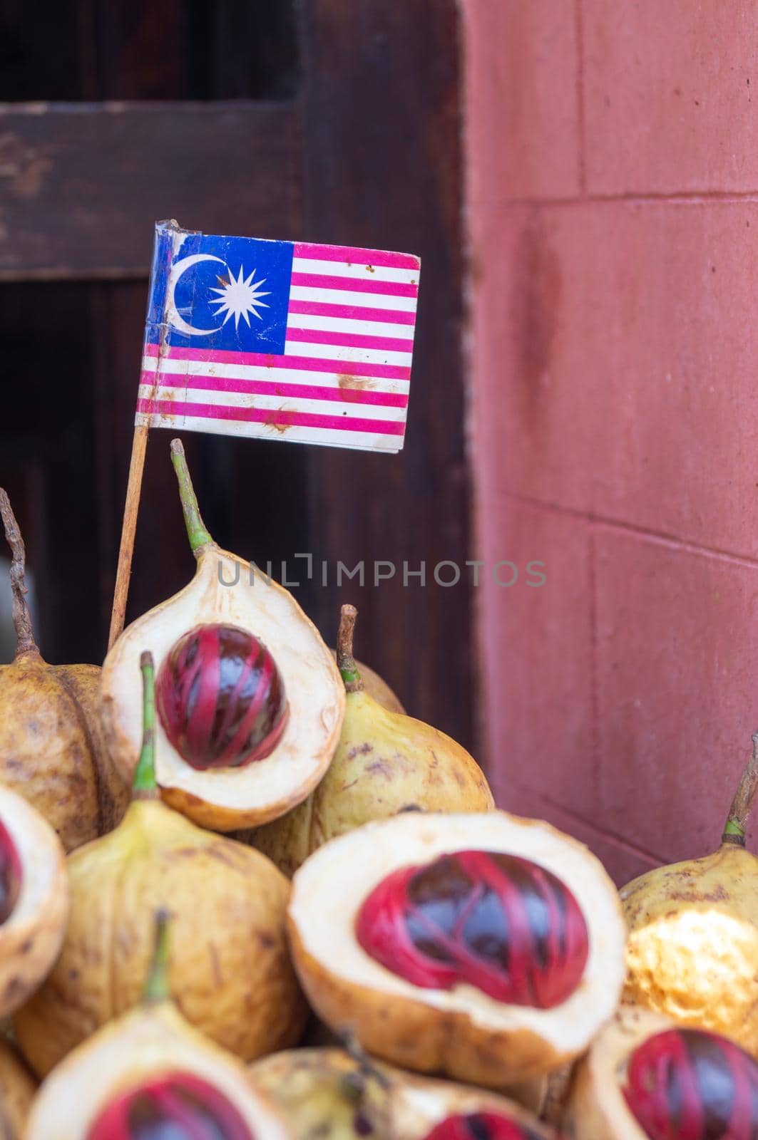 Georgetown, Penang/Malaysia - Feb 29 2020: A Malaysia flag is on nutmeg fruit.