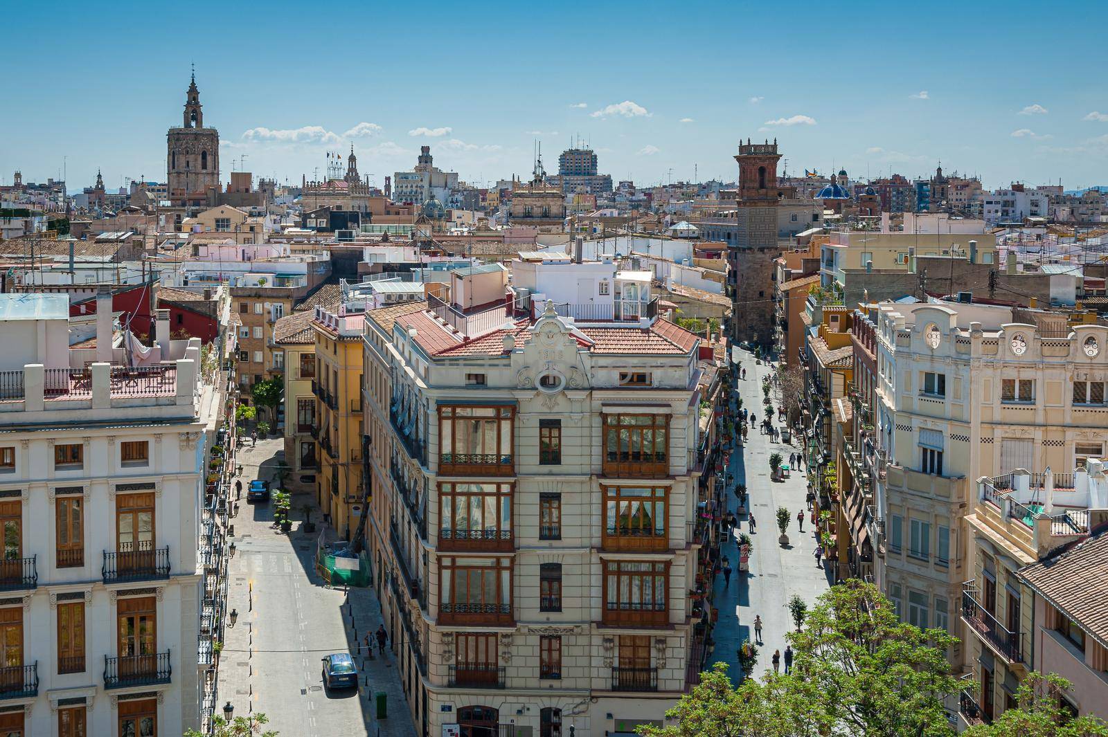 View at Valencia downtown with people walking in the street. Rooftops of Valencia downtown. Spain. Europe. by Qba
