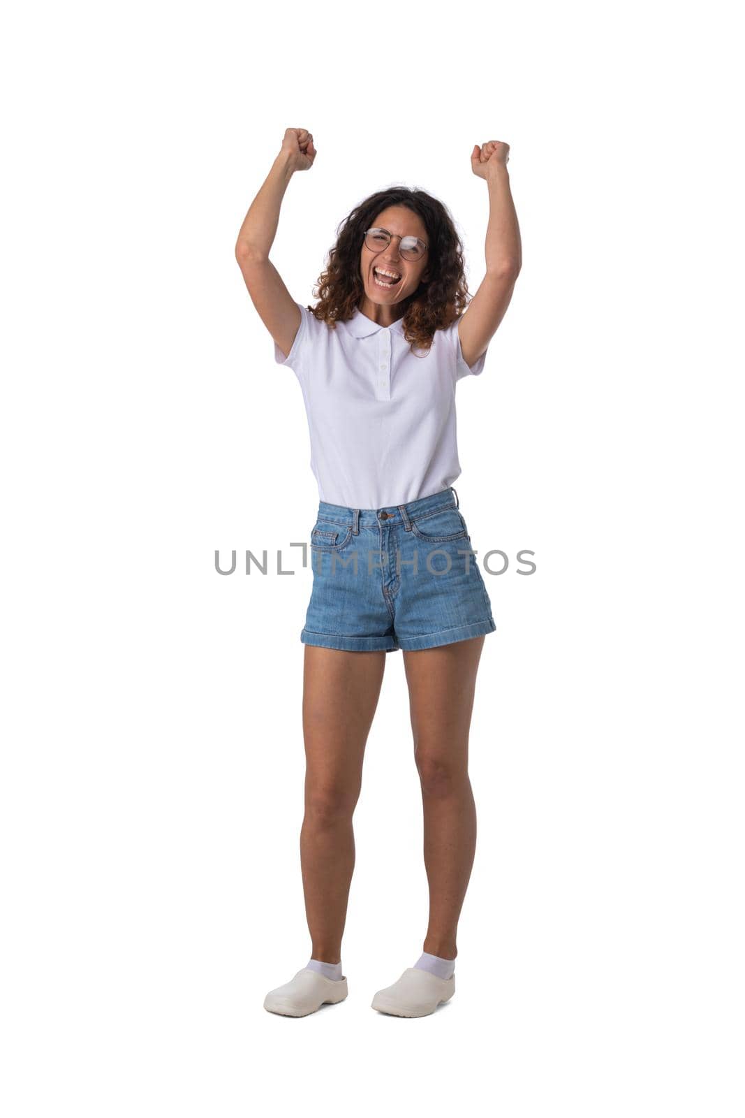 Happy woman with arms raised by ALotOfPeople