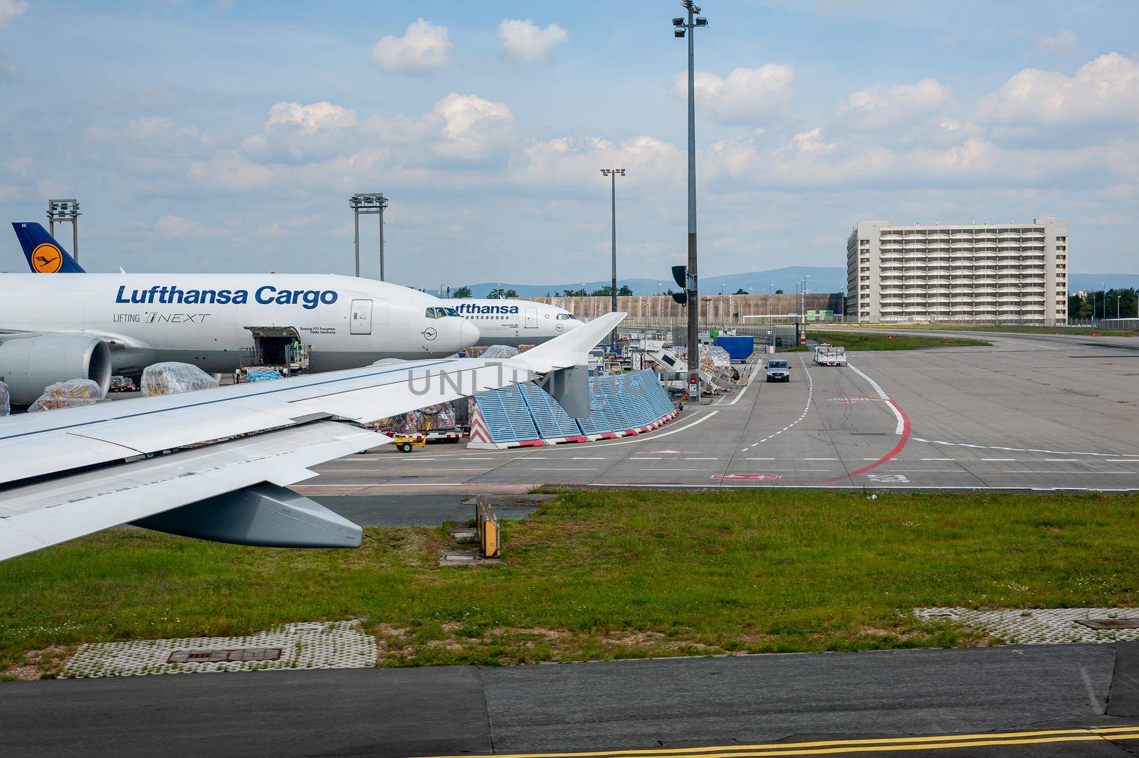 05/26/2019. Frankfurt Airport, Germany. Boeing 777 Freighter and Airbus A220 in Lufthansa cargo depot operated by Fraport and serves as the main hub for Lufthansa. by Qba