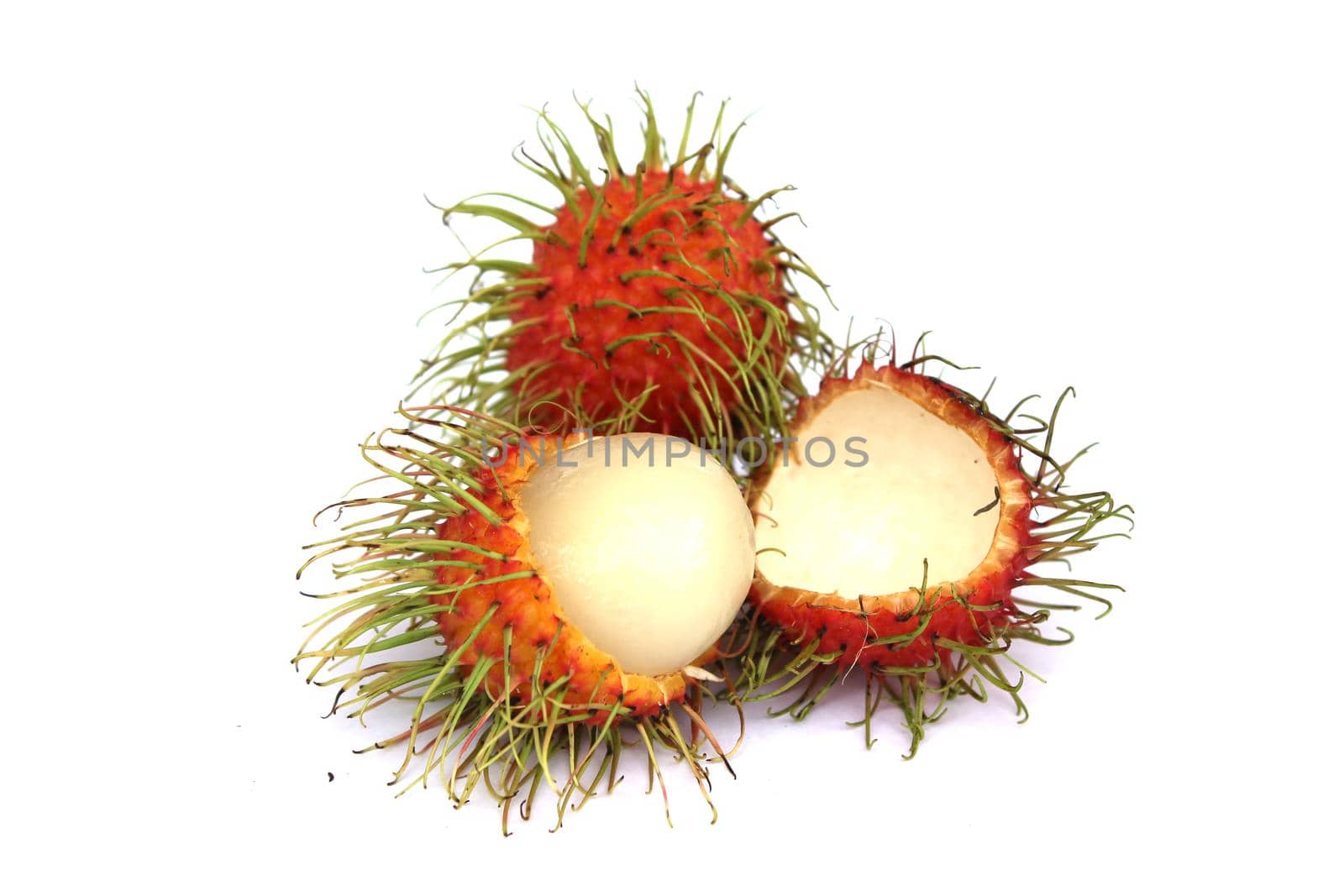 Sweet rambutan, the popular fruit of Thailand Peel off the bark to reveal the inside. isolated from a white background
