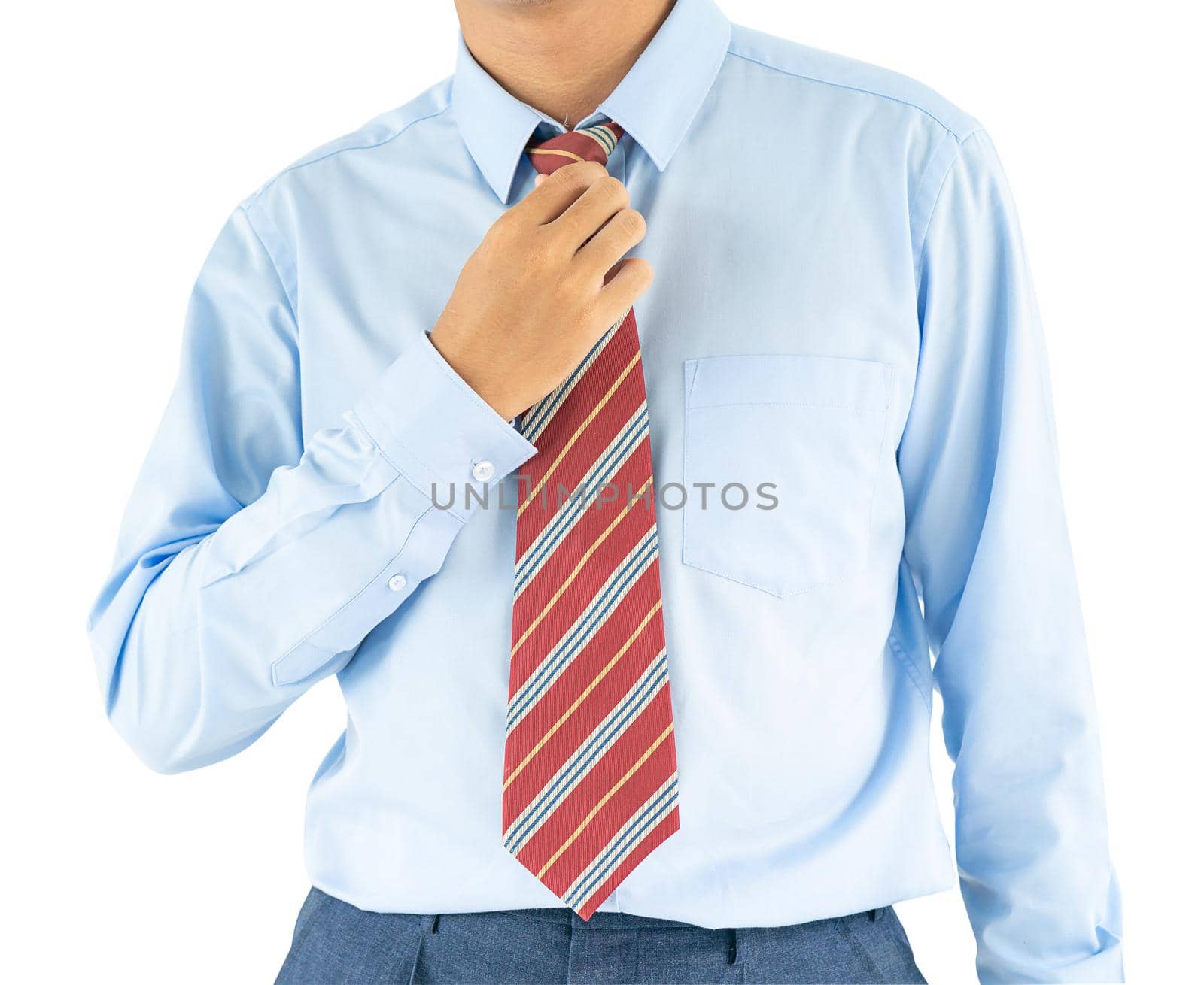 Close up, Male wearing blue shirt and red tie, he tighten the tie knot with clipping path