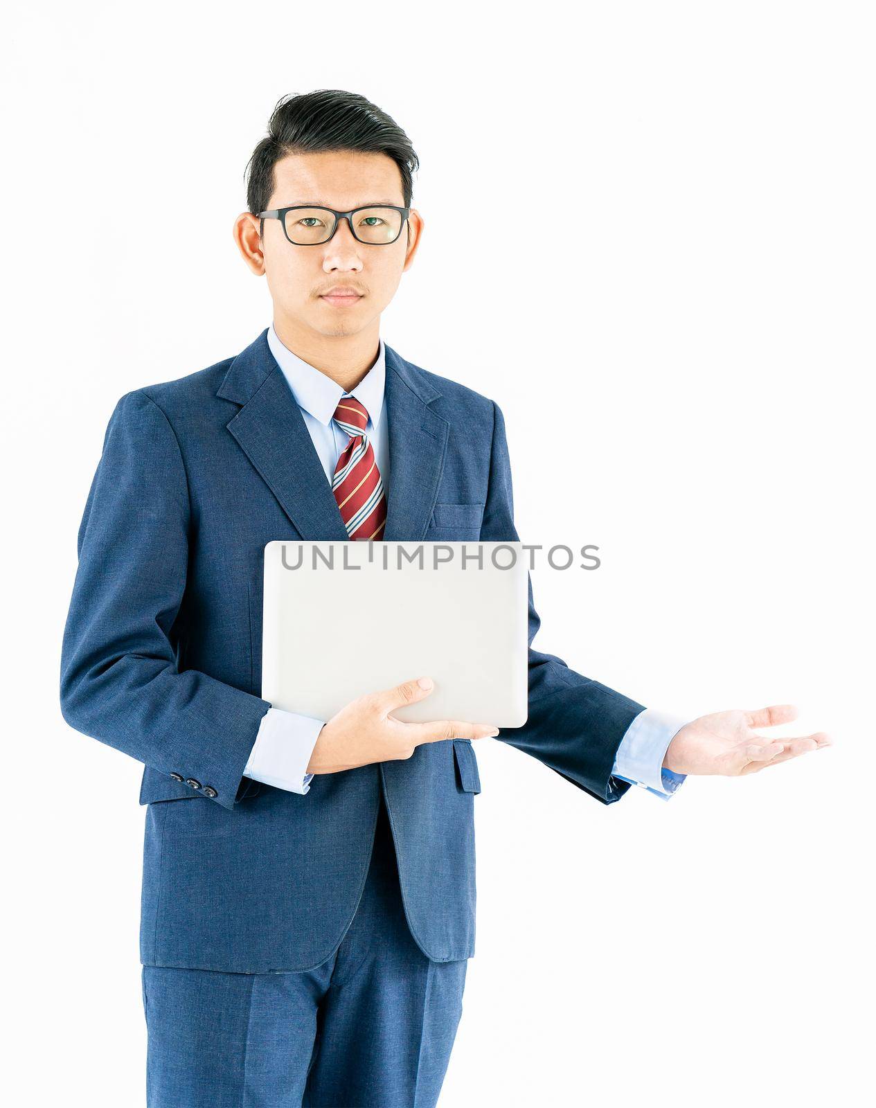 Businessman portrait in suit holding a laptop over white background by stoonn