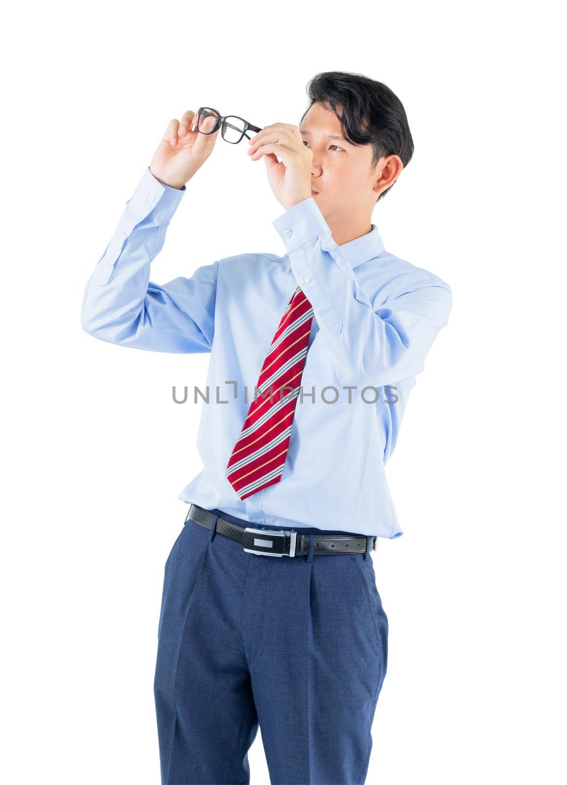 Male wearing blue shirt and red tie reaching posing in studio isolated on white background with clipping path