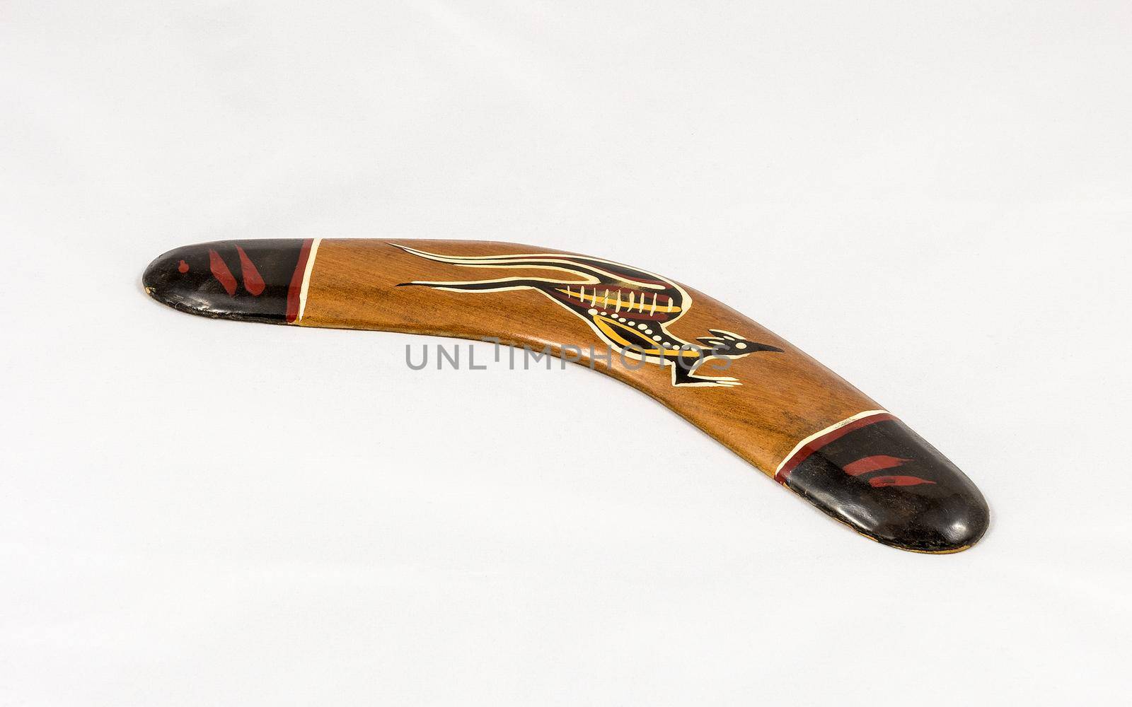 Brown wooden decorated australian boomerang by marcorubino