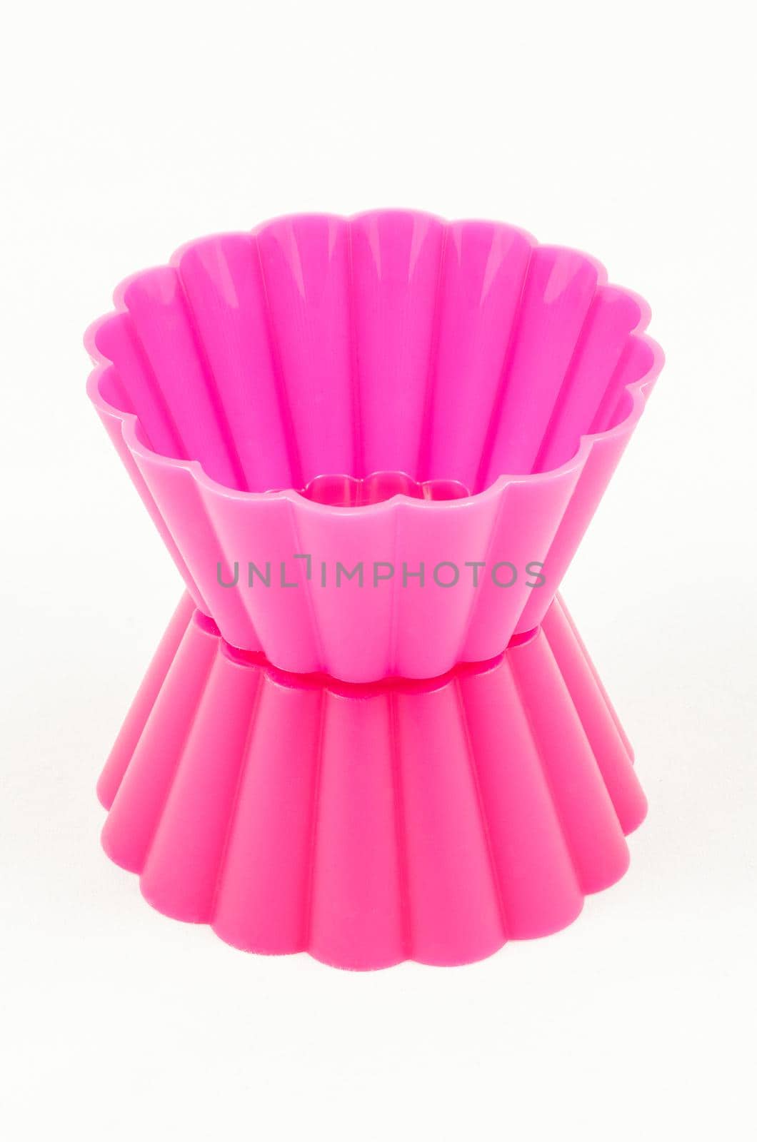 Pink silicone cake cups isolated on white background