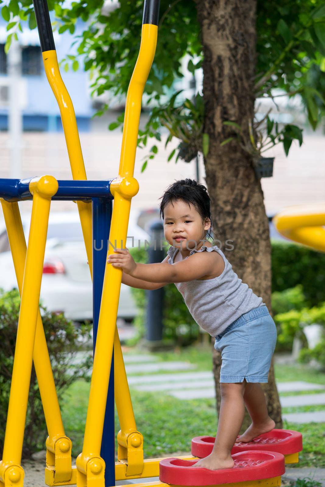 Little girl exercise in the park