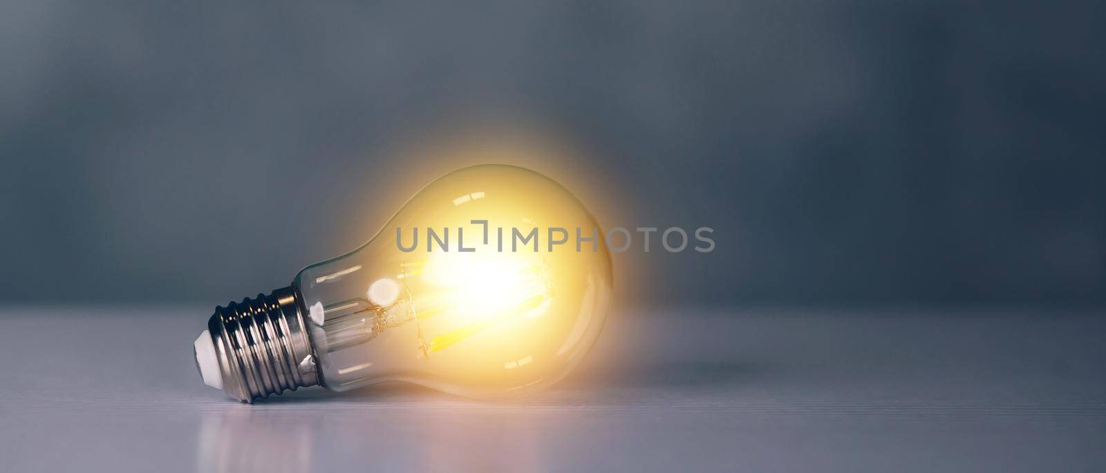 Light bulb with symbol of idea and inspiration, lightbulb with thinking and imagination efficient for success, solution and invention, bright of incandescent, strategy and planning, business concept. by nnudoo