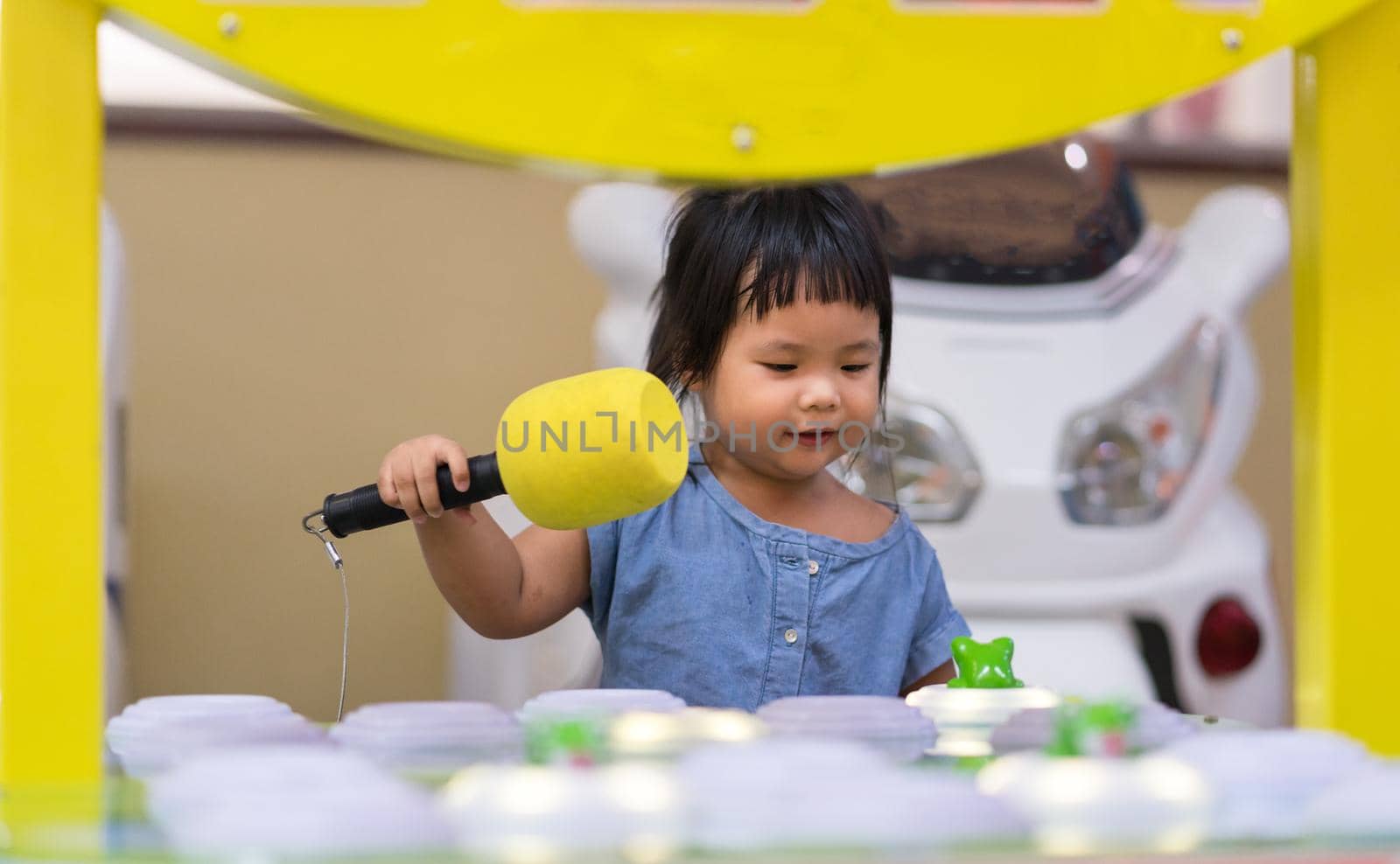 Little girl playing at playground and fun with game